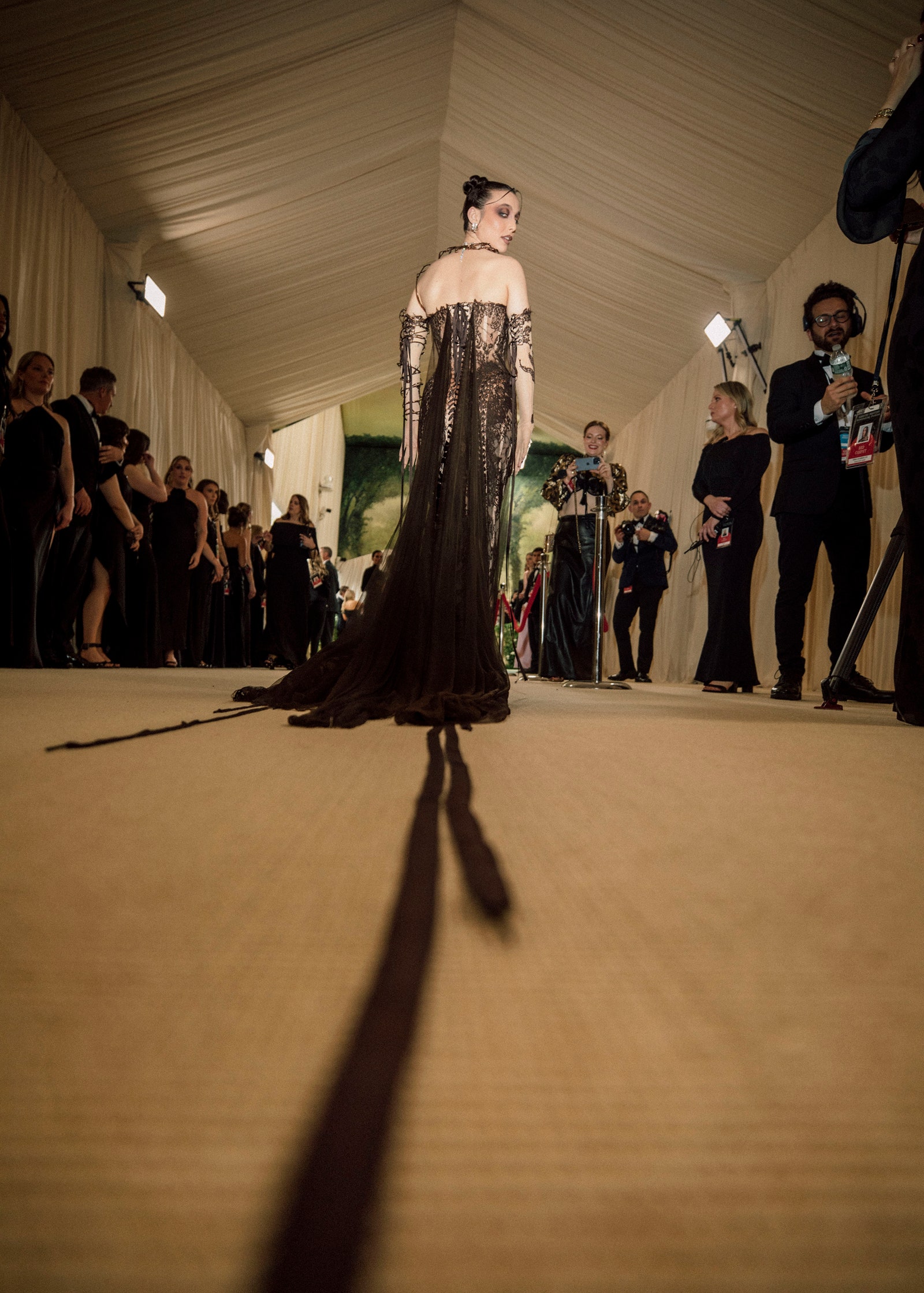 Image may contain Emma Chamberlain Clothing Dress Formal Wear Photography Person Adult Wedding Footwear and Shoe