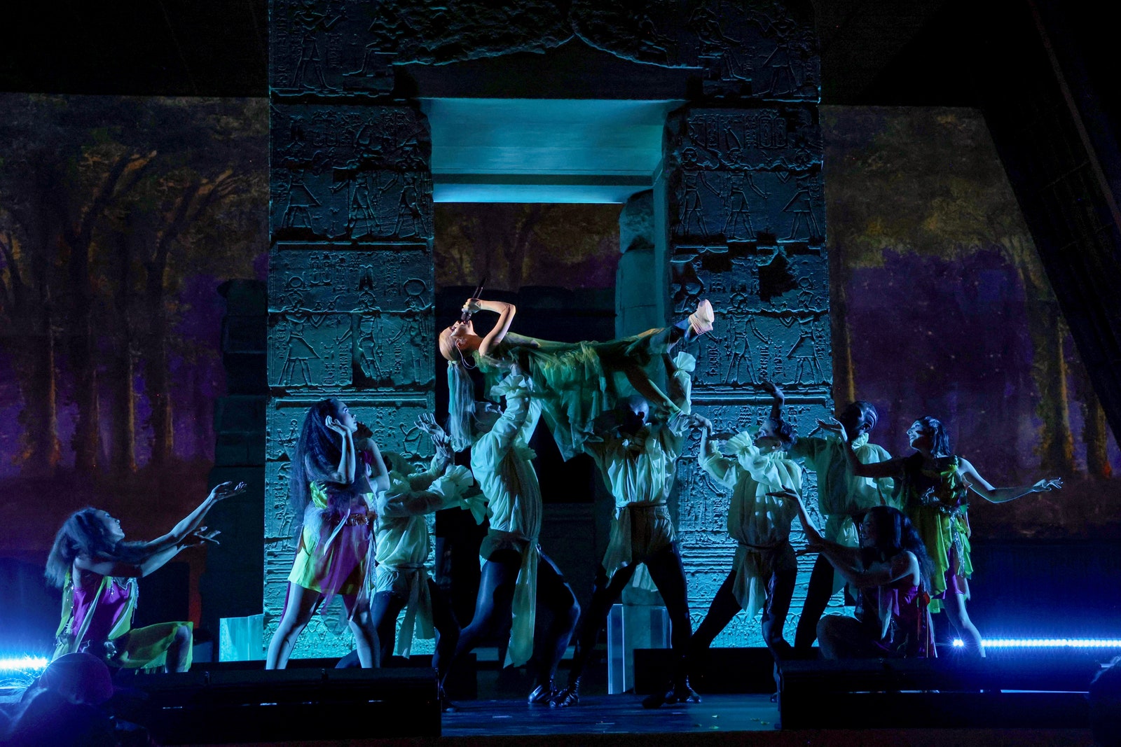 Image may contain Stage Group Performance Person Adult Clothing Footwear High Heel Shoe and Dancing
