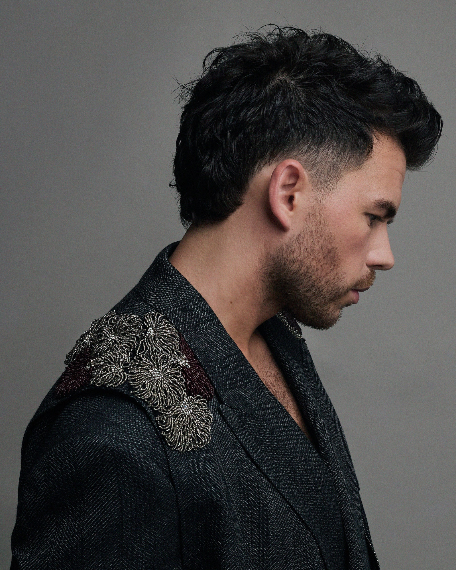 Image may contain Adult Person Black Hair Hair Face Head Photography and Portrait