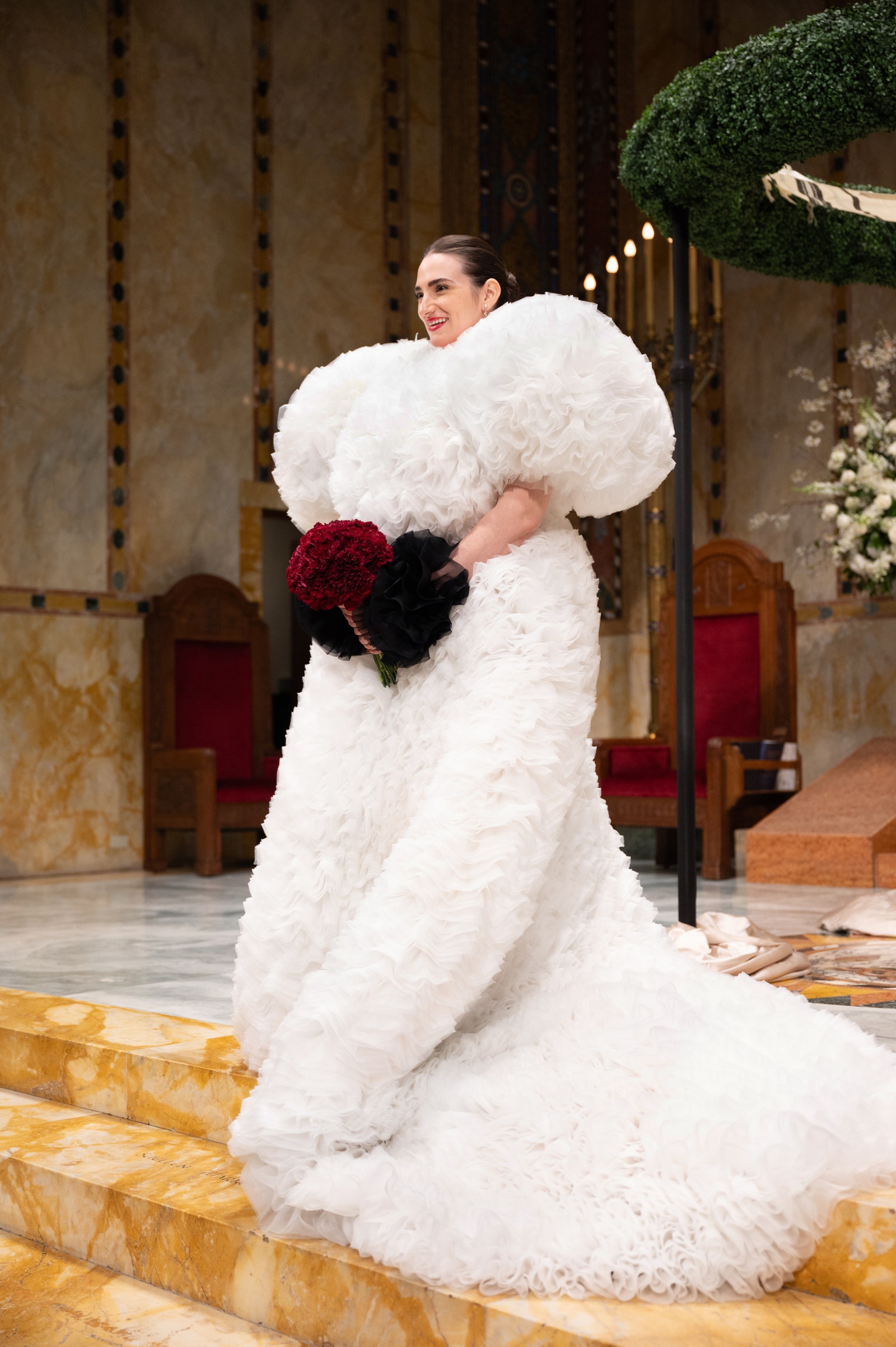 Image may contain Clothing Dress Fashion Formal Wear Gown Wedding Wedding Gown Chair Furniture Face and Head