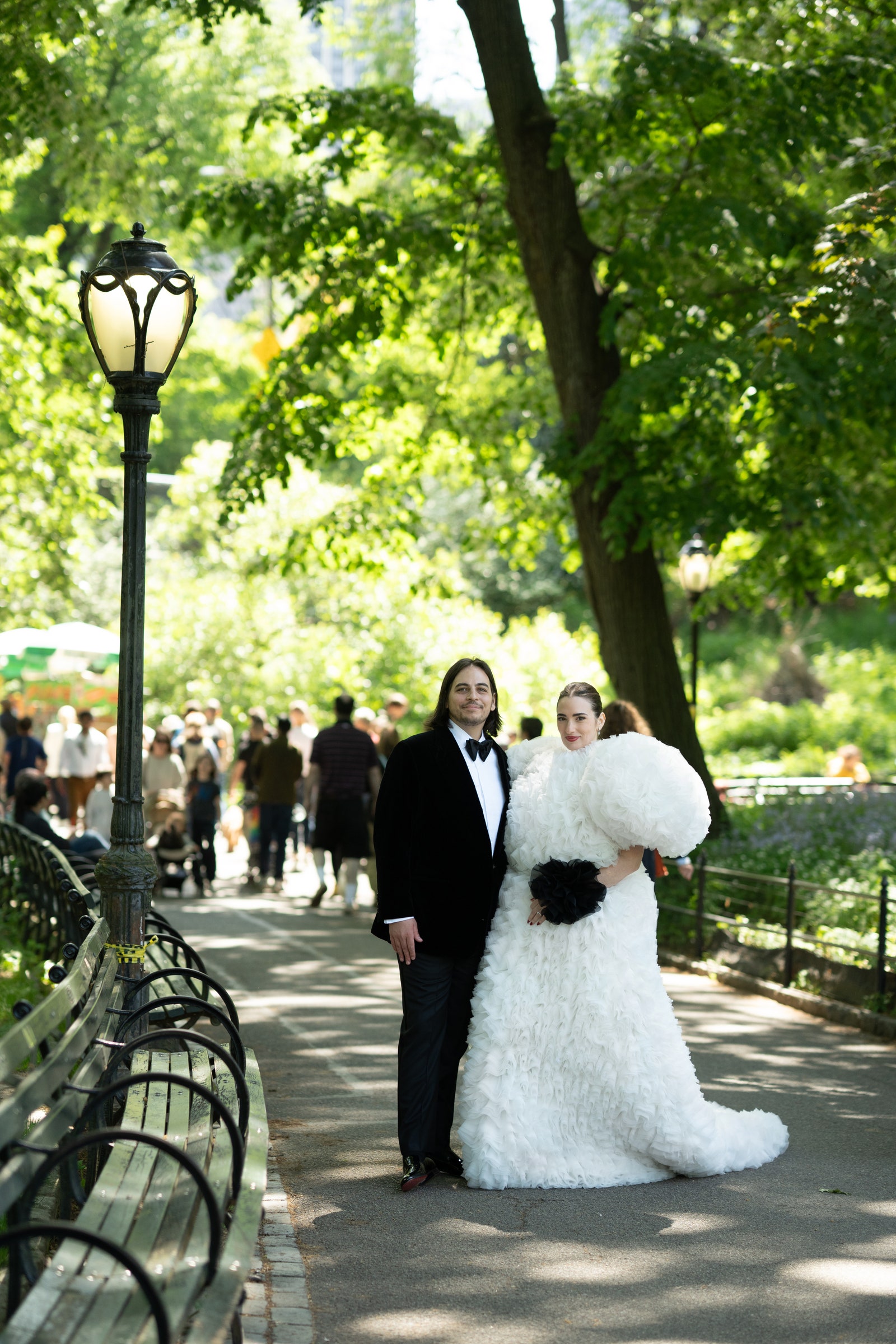 Image may contain Clothing Formal Wear Suit Dress City Road Street Urban Grass Nature Outdoors Park and Plant