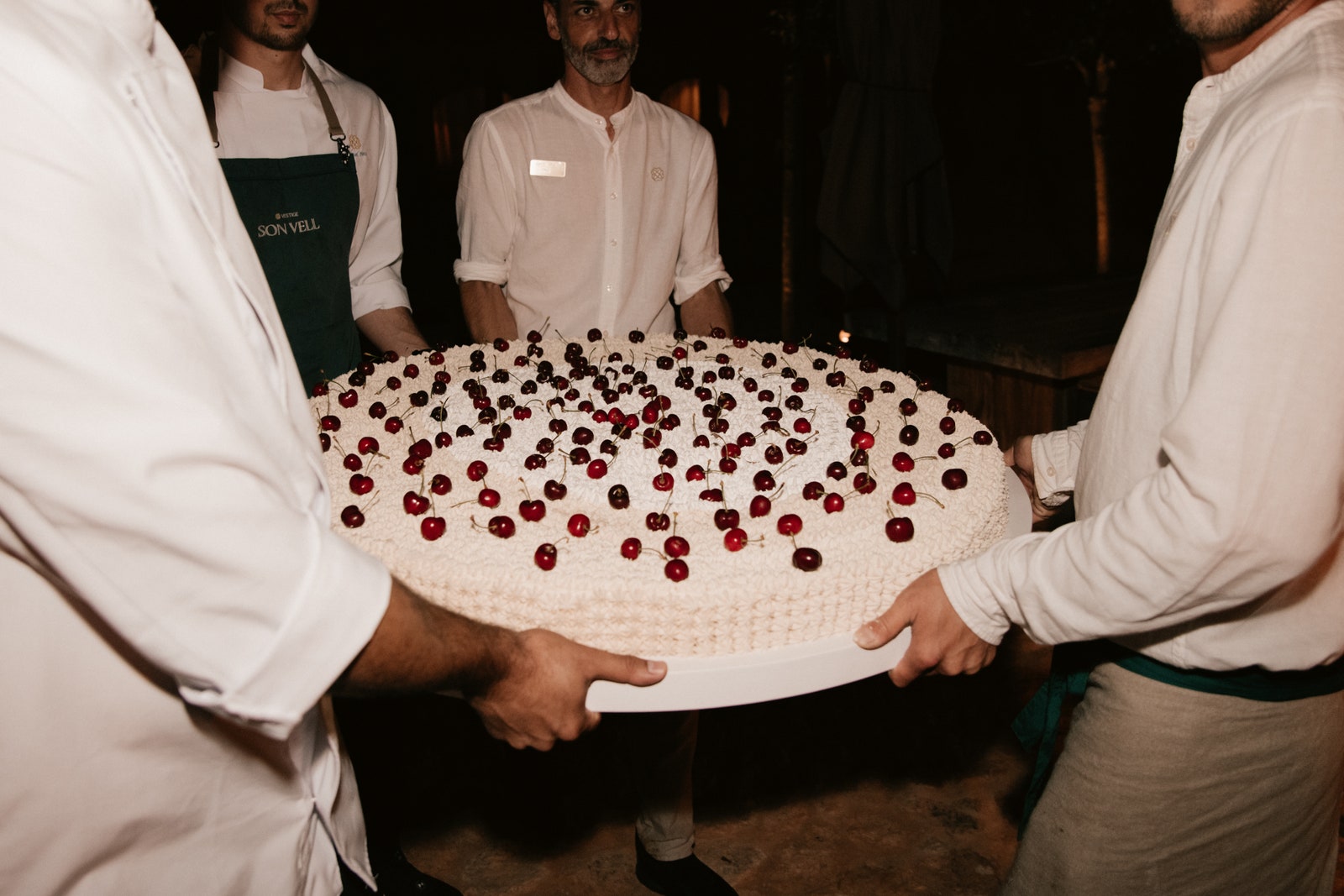 Image may contain Adult Person Cake Dessert Food Torte People Birthday Cake Cream Clothing Footwear and Shoe