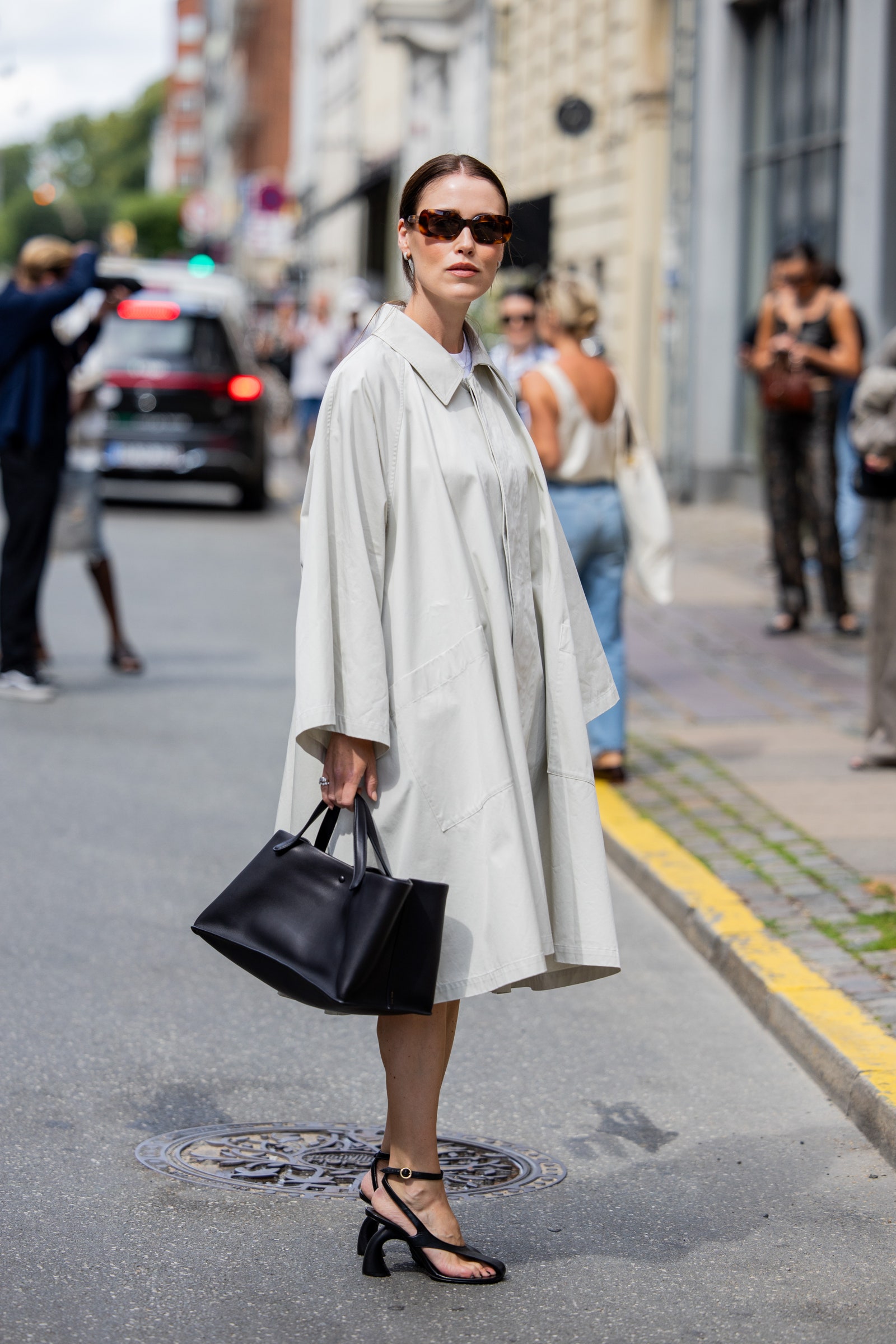 Image may contain Jane Altschwager Clothing Coat Accessories Glasses Footwear High Heel Shoe Bag Handbag and Adult