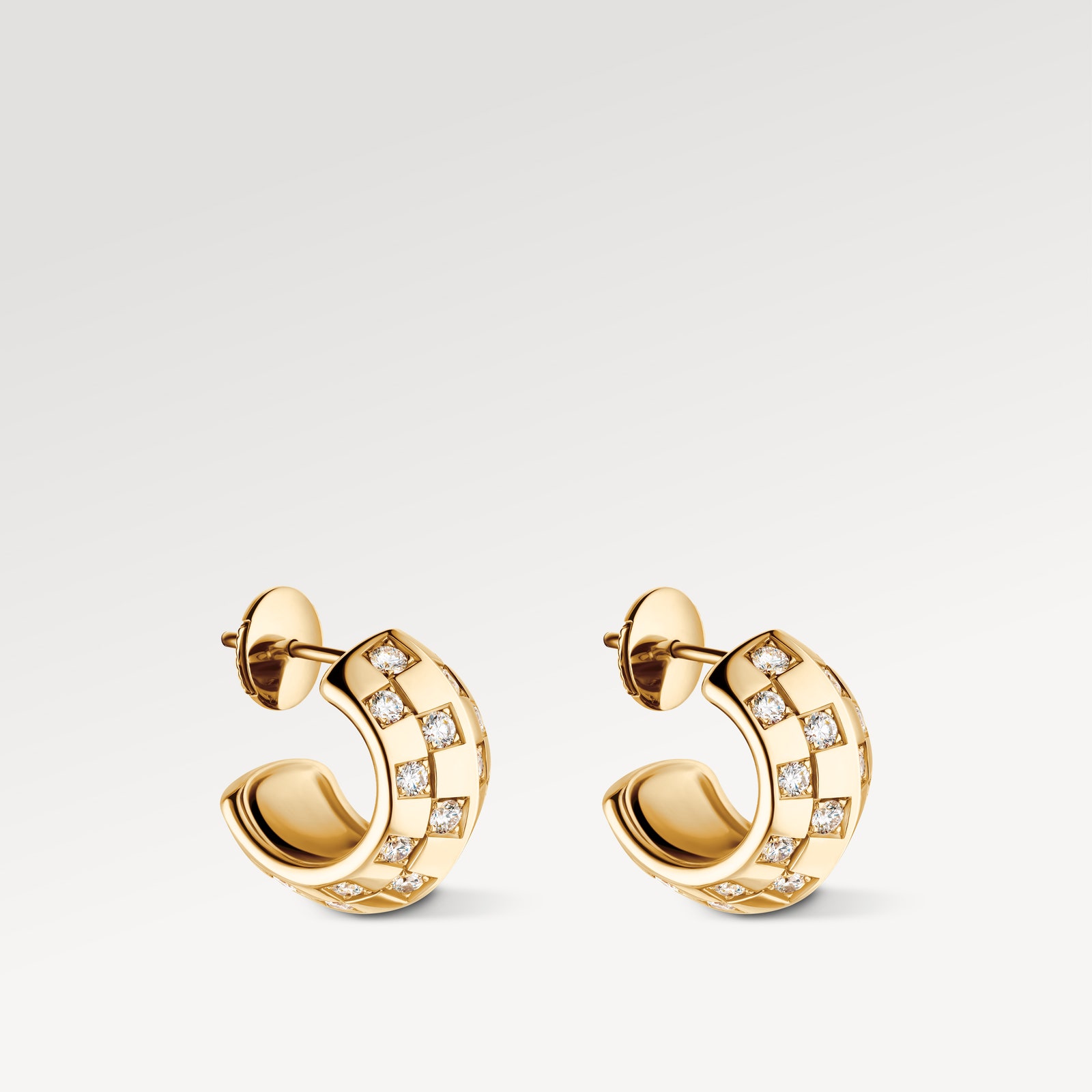 Image may contain Accessories Earring Jewelry Diamond Gemstone and Gold