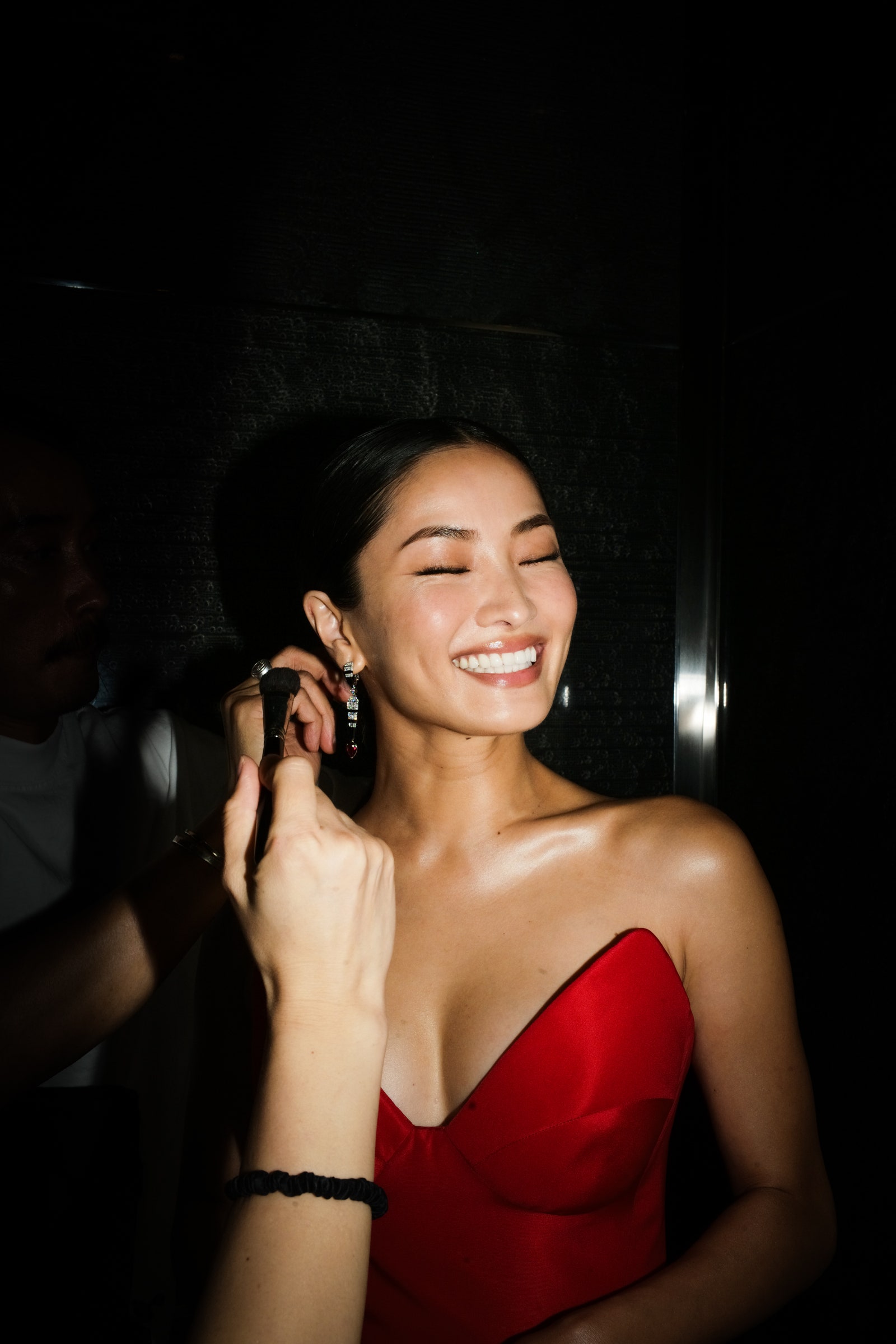 Image may contain Face Head Person Photography Portrait Clothing Dress Body Part Finger Hand and Formal Wear