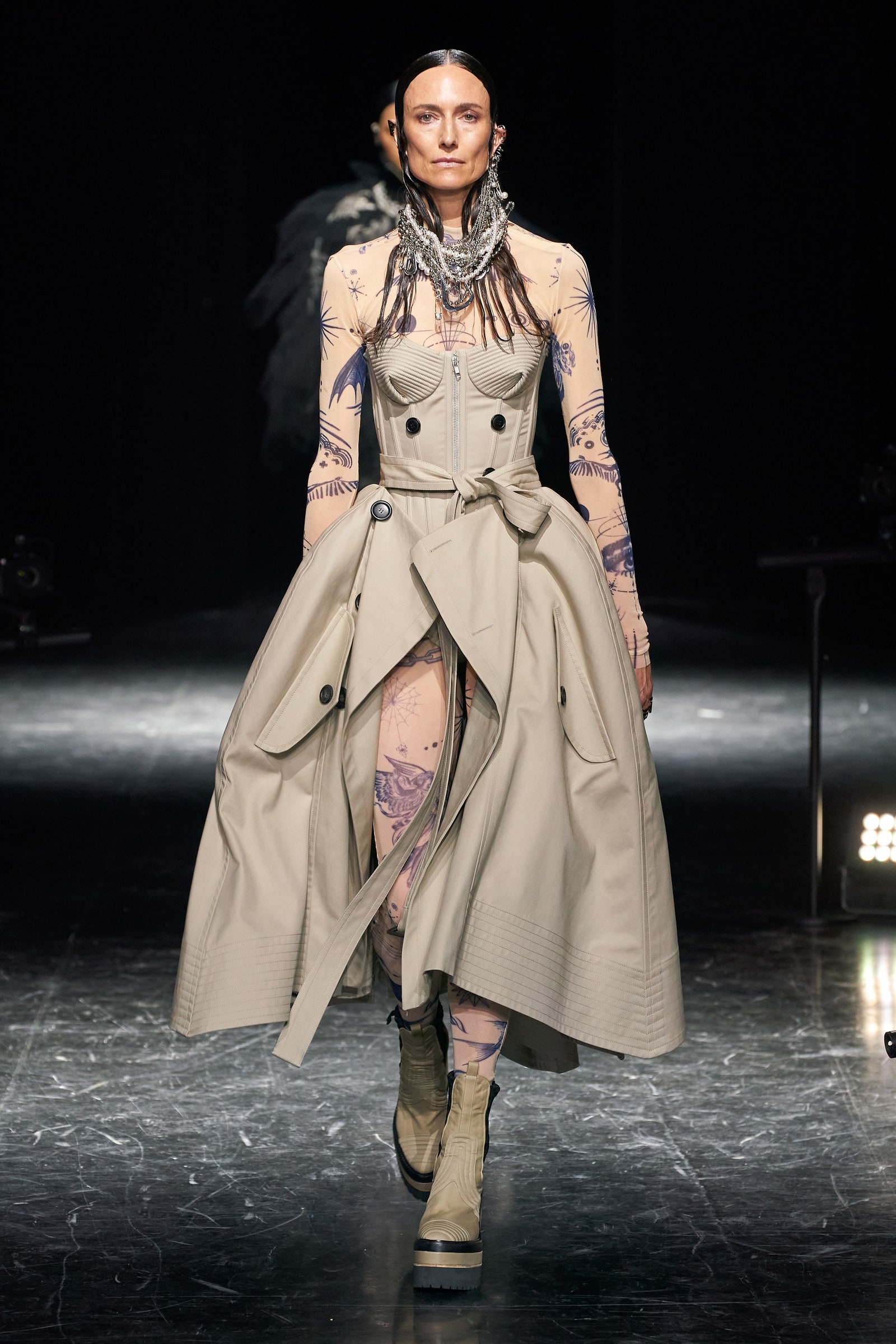 Image may contain Clothing Apparel Coat Overcoat Human Person Sleeve and Fashion