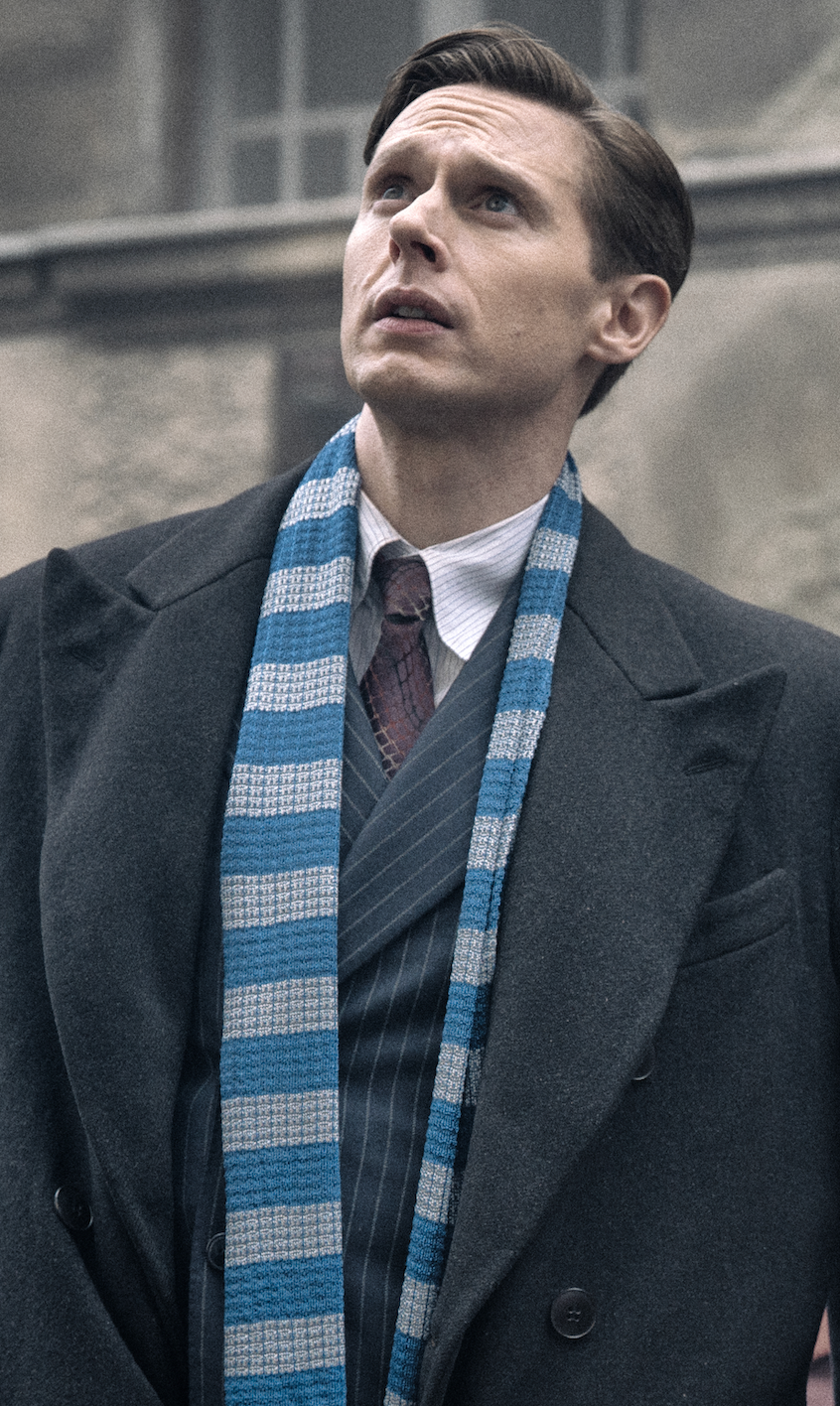 Image may contain Samuel Barnett Accessories Formal Wear Tie Necktie Clothing Coat Adult Person Shirt and Face