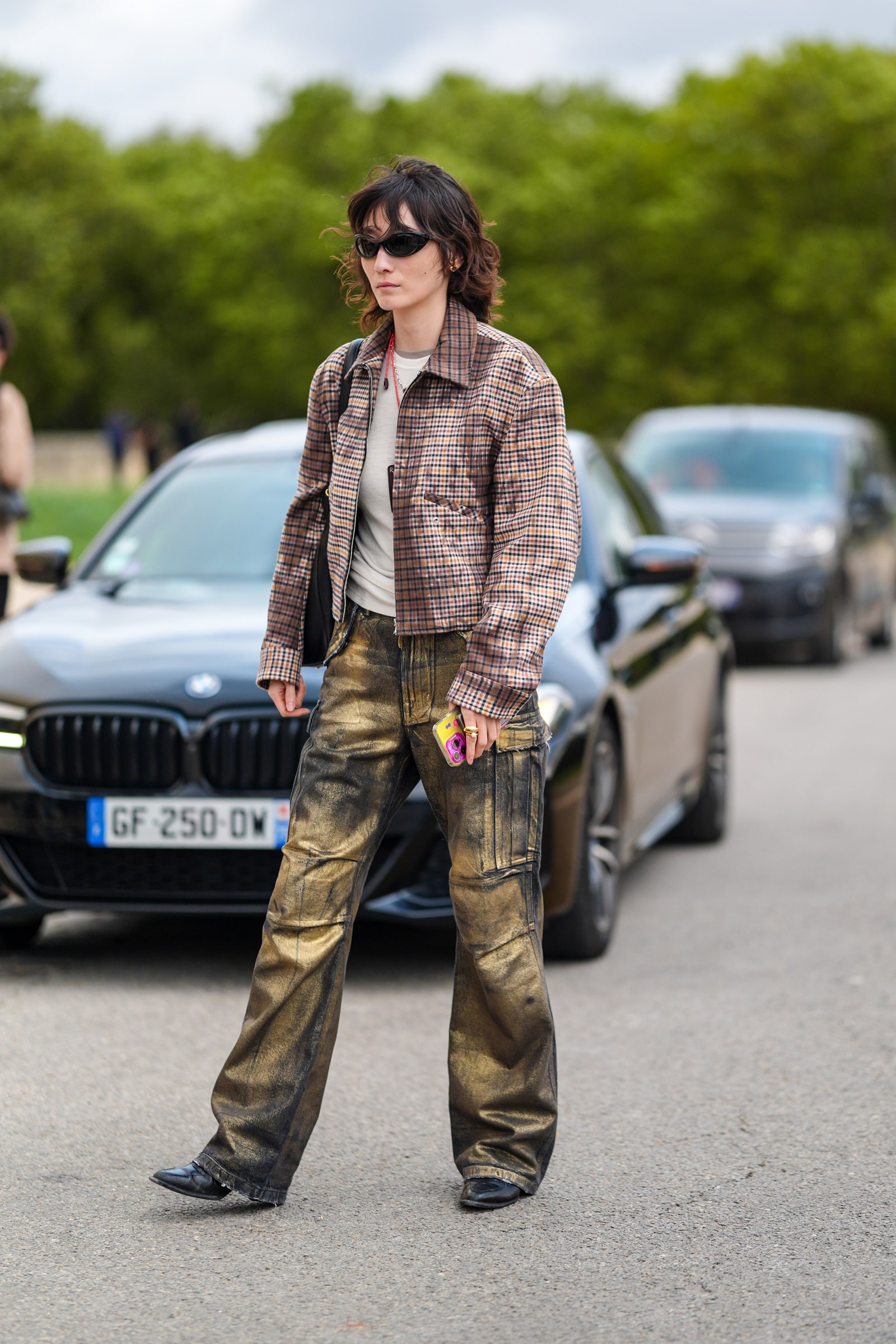 Image may contain Clothing Pants Jeans Adult Person Footwear Shoe Accessories Glasses Car and Transportation