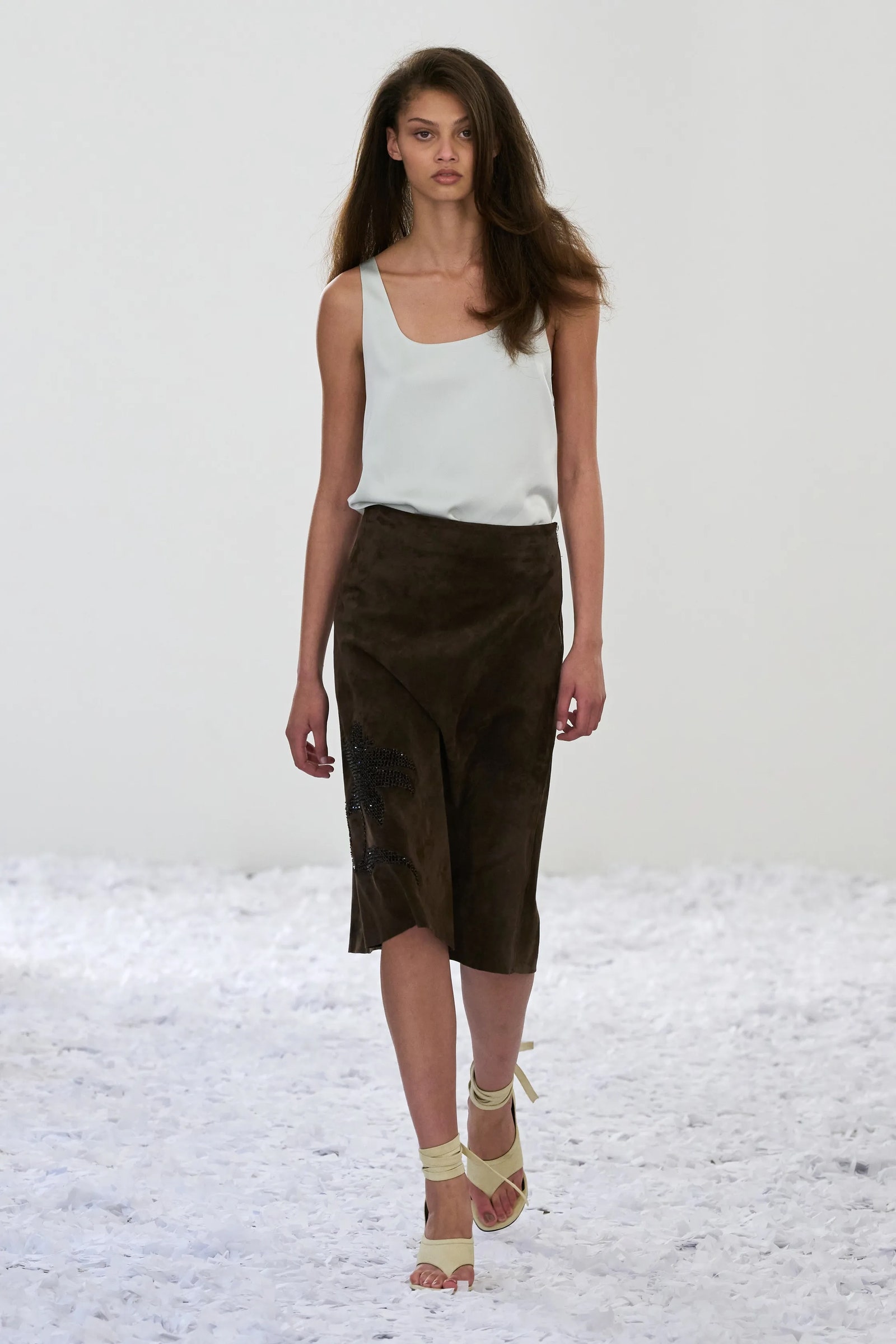 Image may contain Clothing Skirt Shorts Person Teen Footwear Sandal and Pants