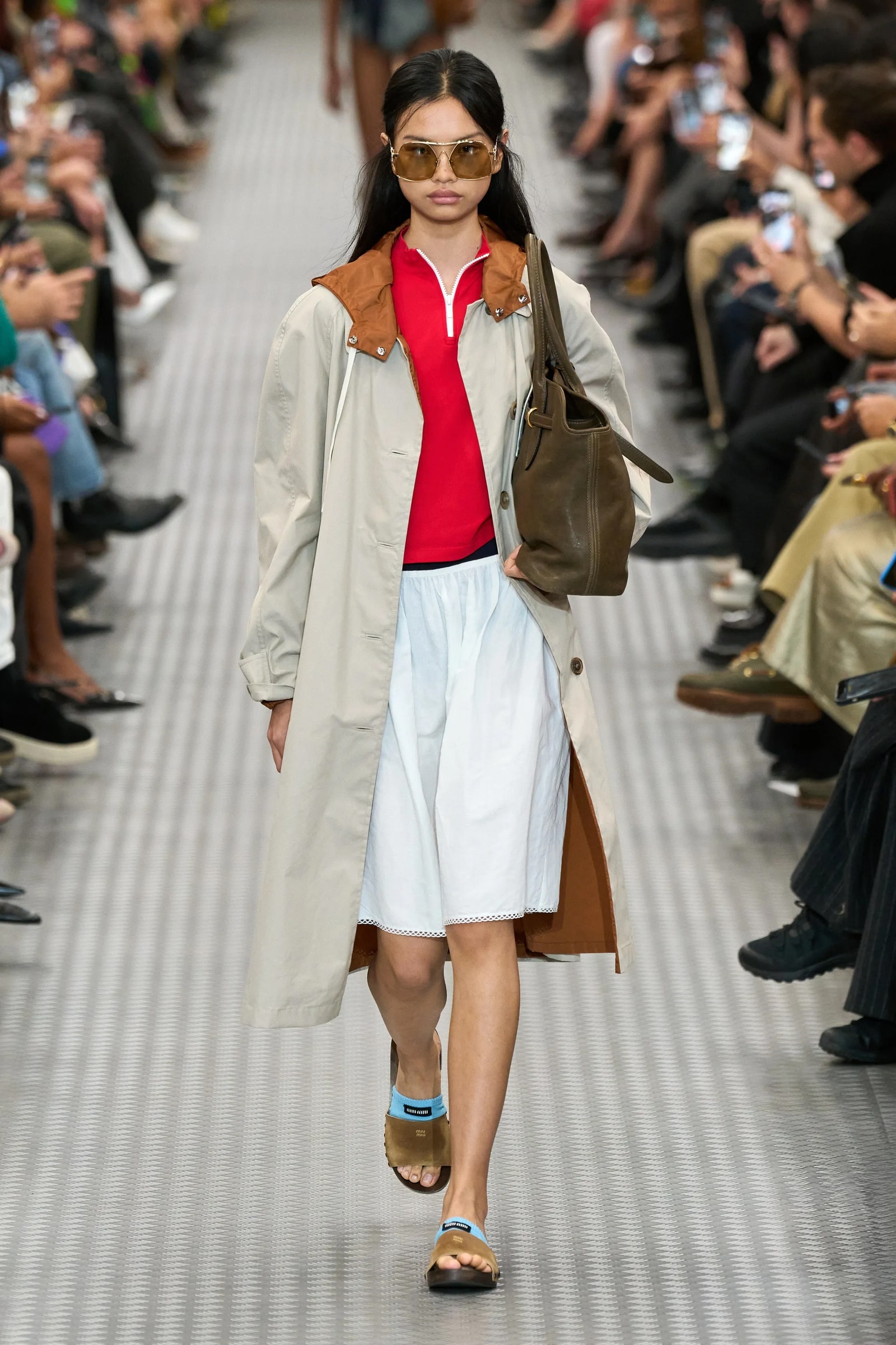 Image may contain Clothing Coat Accessories Bag Handbag Footwear Shoe Person Adult Glasses and Sandal