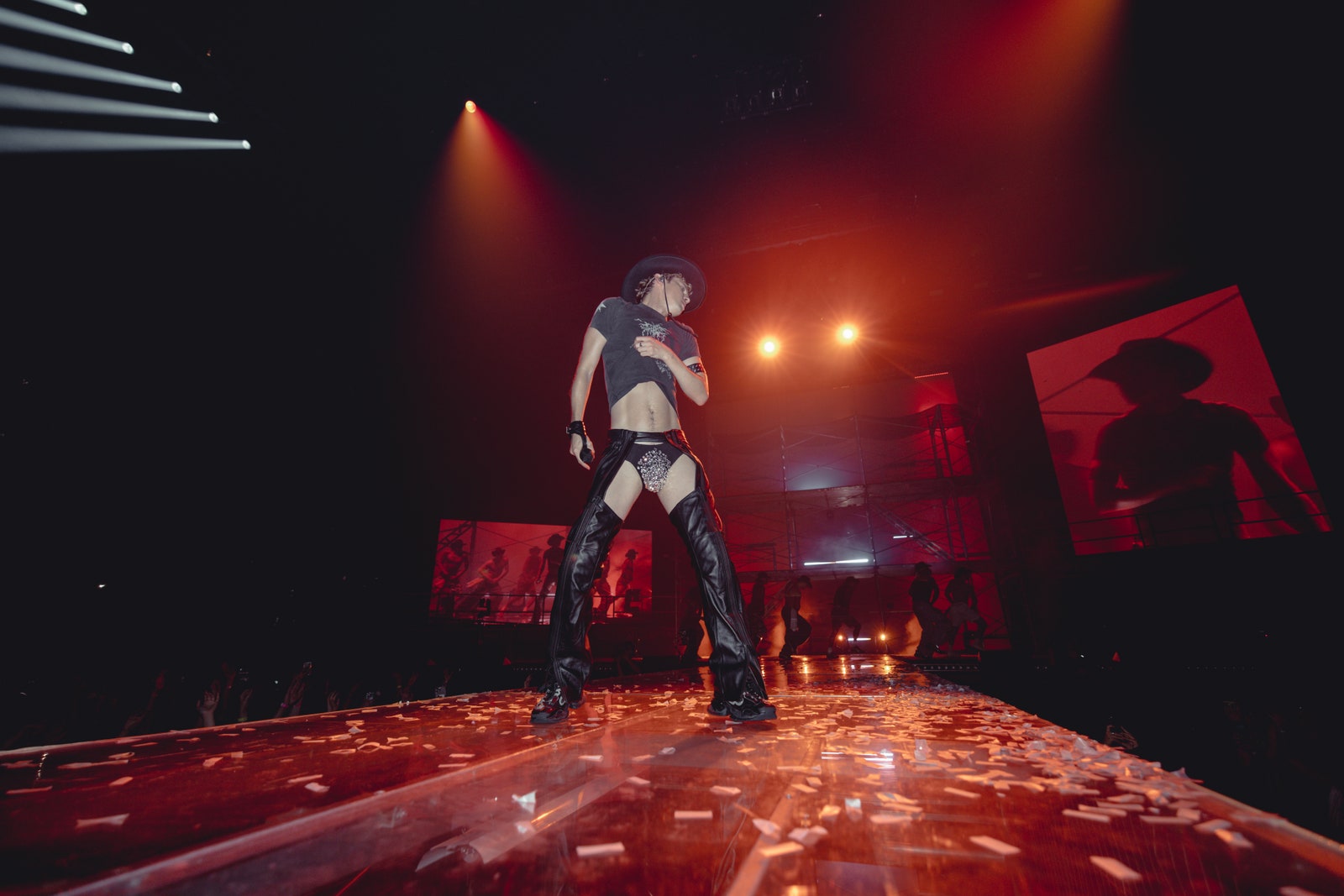 Image may contain Lighting Performer Person Solo Performance Adult Clothing Footwear Shoe Urban Hat and Concert
