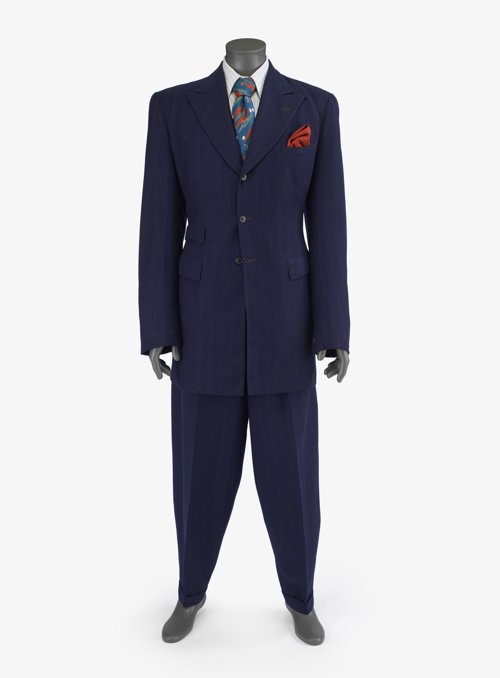 Image may contain Clothing Formal Wear Suit Tuxedo Coat Accessories Tie and Jacket