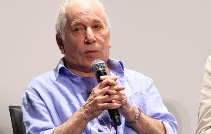 Paul Simon hasn't "accepted" his hearing loss, but is looking for a solution