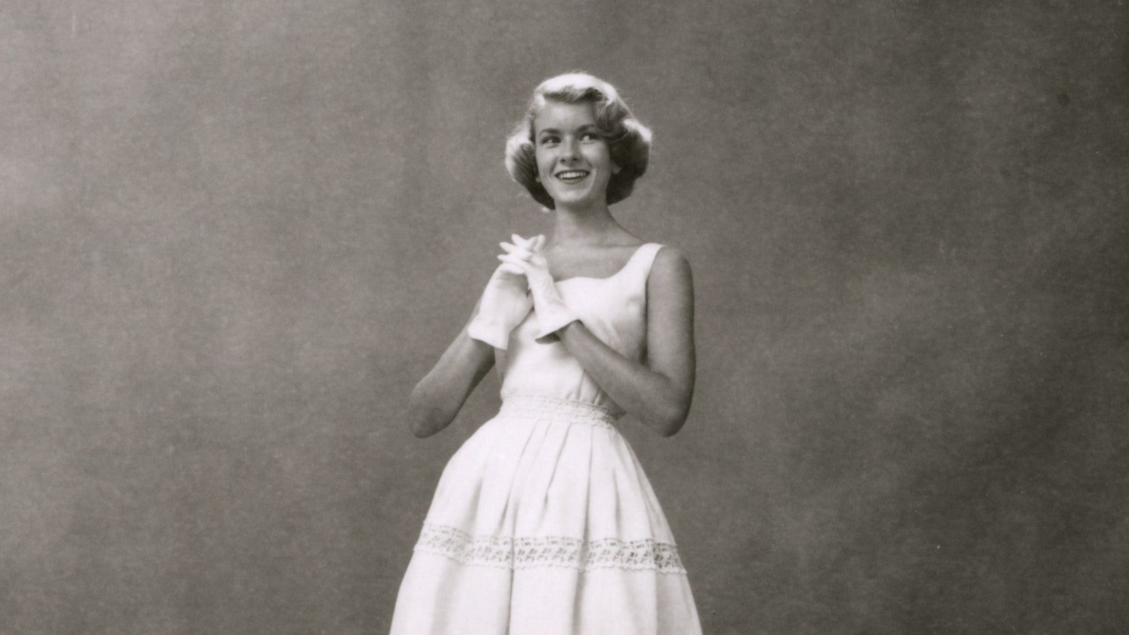 Image may contain Martha Stewart Photography Face Head Person Portrait Clothing Dress Happy and Formal Wear