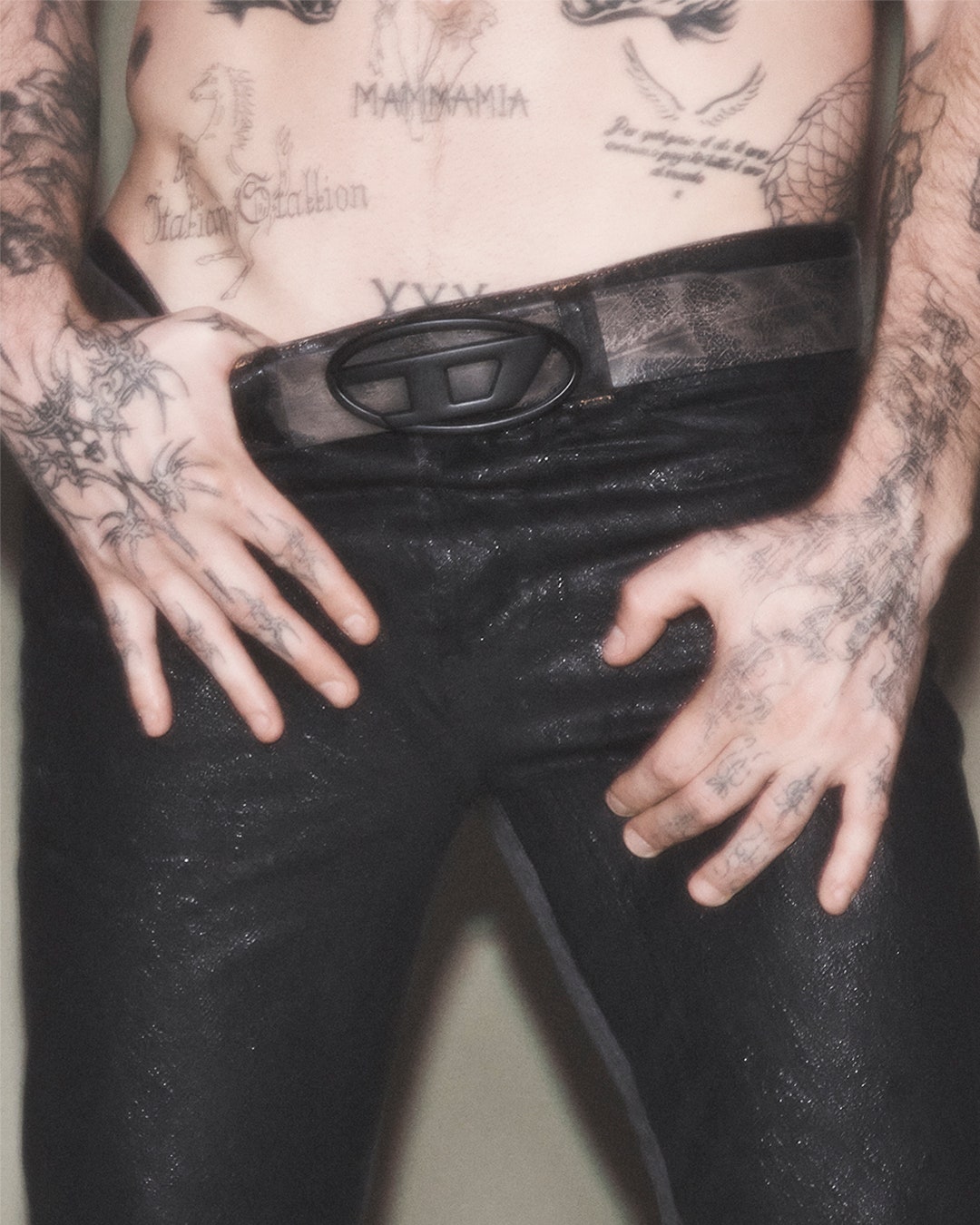 Image may contain Person Skin Tattoo Clothing Pants Adult and Accessories