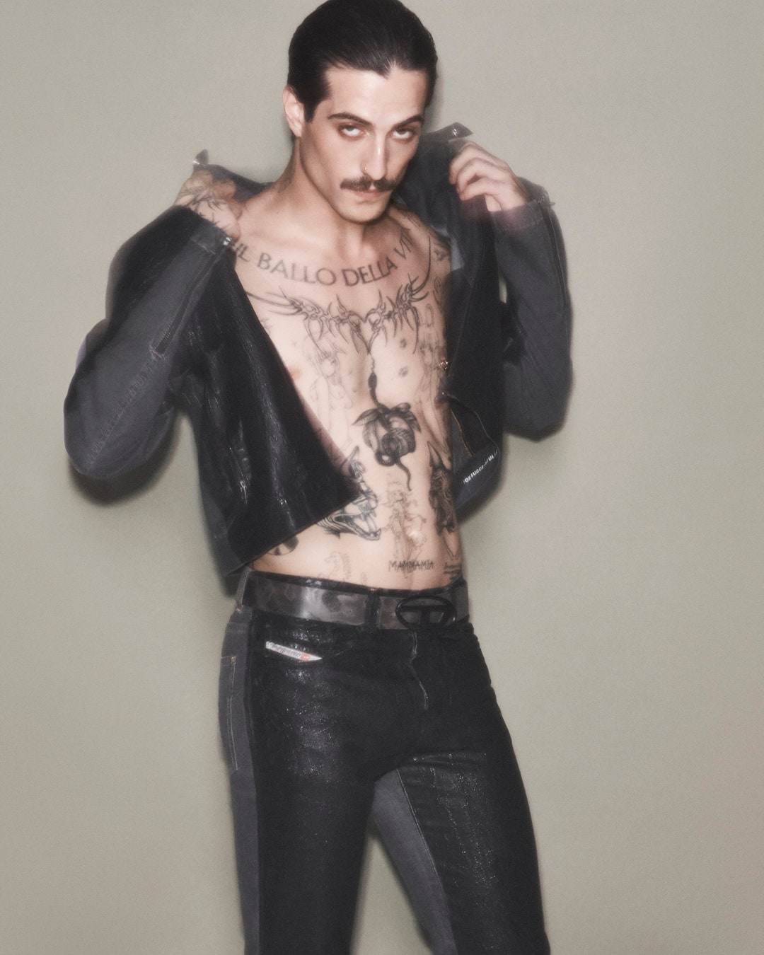 Image may contain Tony Reali Person Skin Tattoo Clothing Pants Adult Jeans Face Head Photography and Portrait