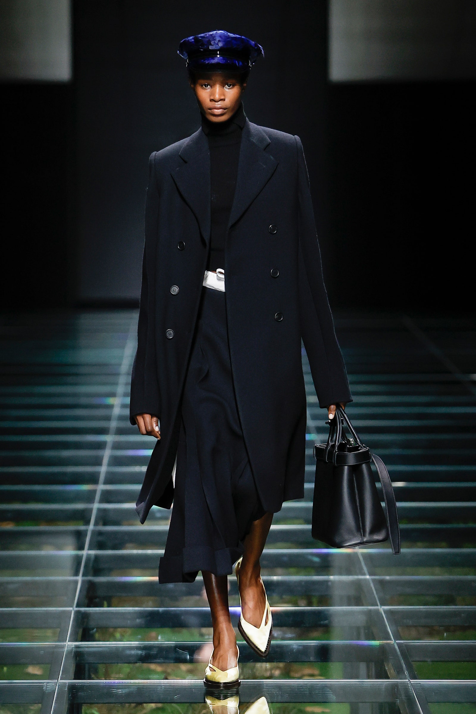 Image may contain Clothing Coat Accessories Bag Handbag Adult Person Fashion Footwear High Heel Shoe and Hat