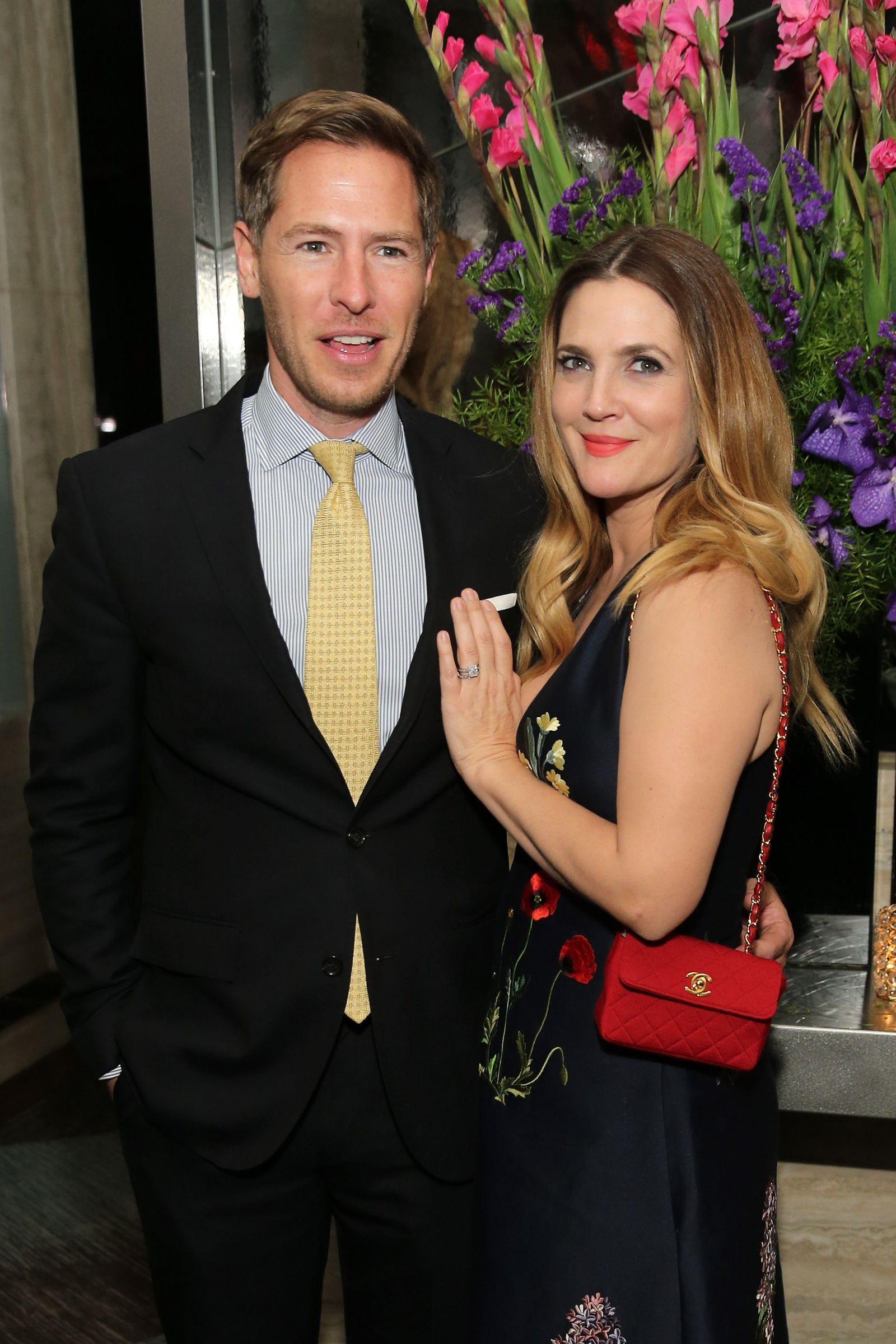 Image may contain Drew Barrymore Tie Accessories Accessory Human Person Suit Coat Clothing Overcoat and Apparel