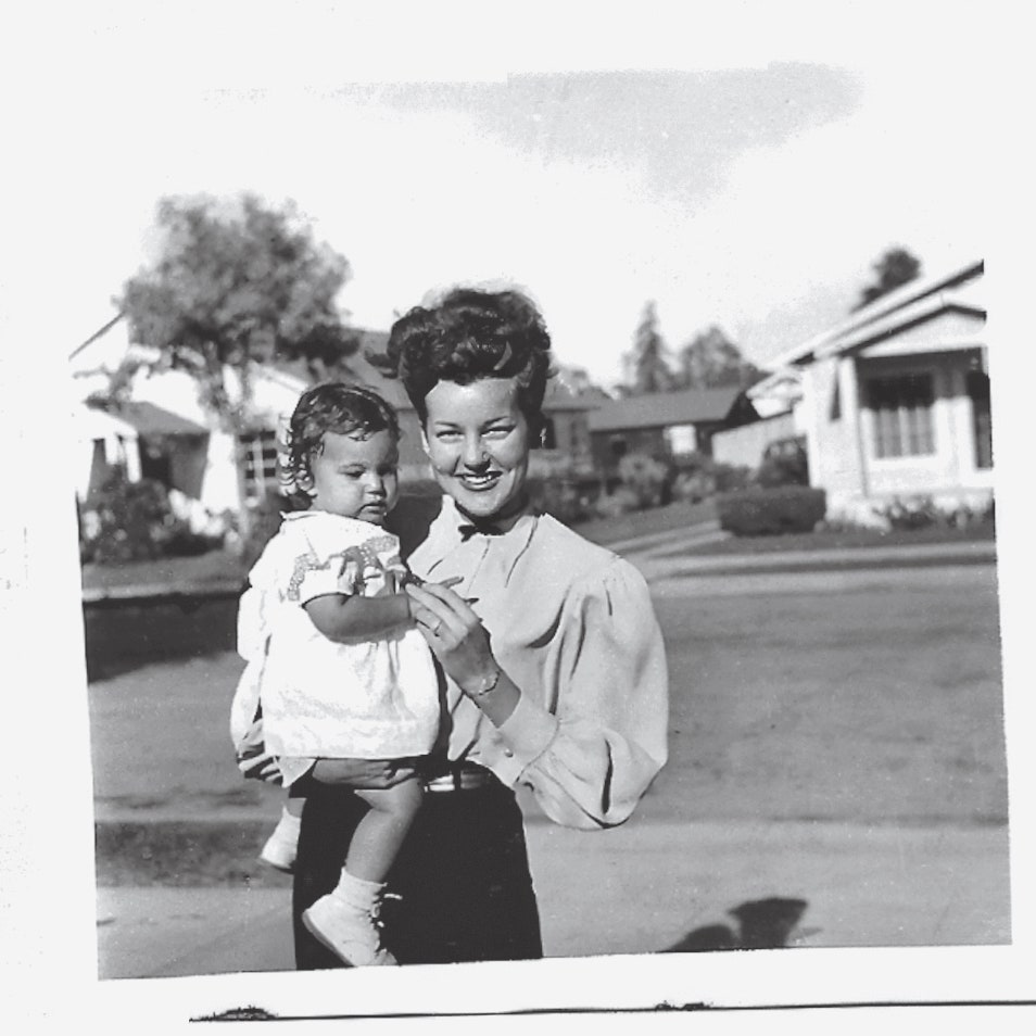 Image may contain Georgia Holt Face Head Person Photography Portrait People Clothing Shorts Dress Grass and Plant