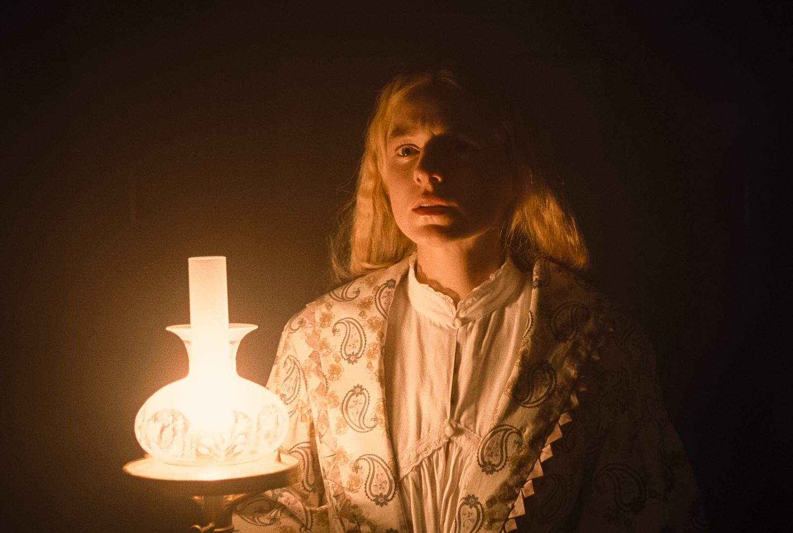 Image may contain Face Head Person Photography Portrait Adult Lamp People and Candle