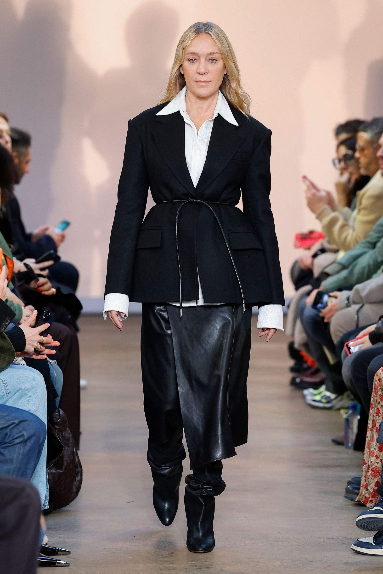 Image may contain Chloë Sevigny Clothing Formal Wear Suit Adult Person Coat Footwear Shoe Accessories and Glasses