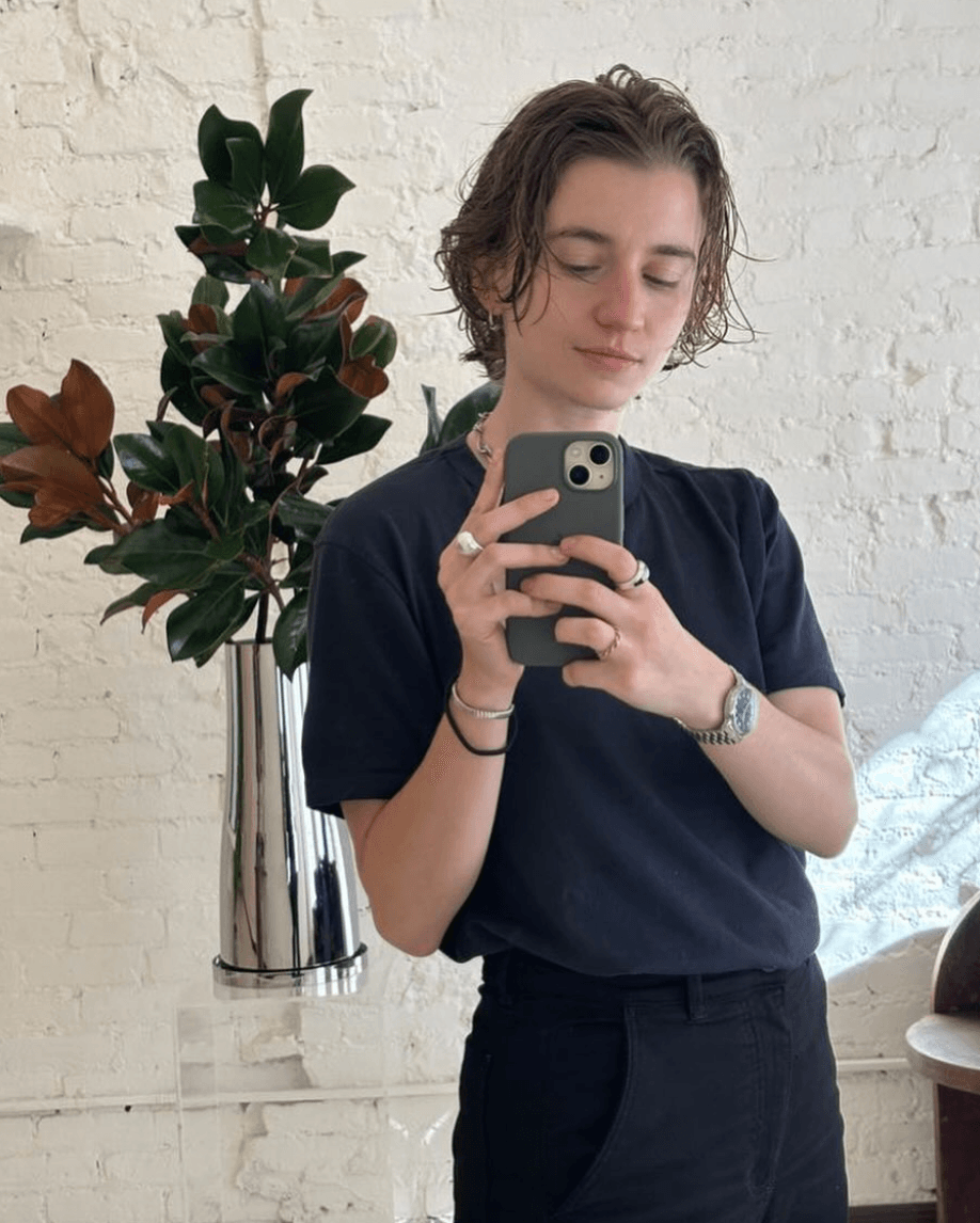 Image may contain Clothing Sleeve Person Teen Plant Face and Head