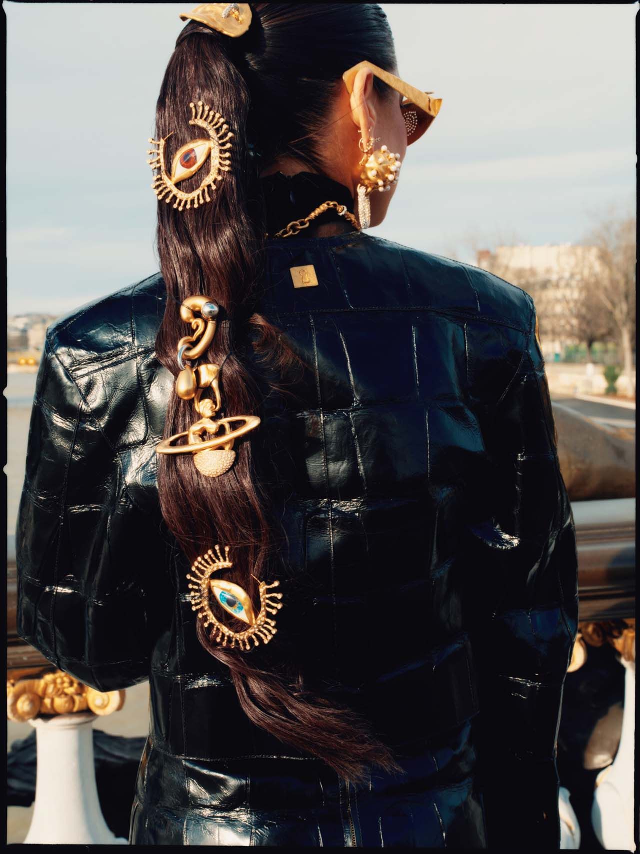Image may contain Clothing Coat Jacket Adult Person Hair Braid Accessories Jewelry and Necklace