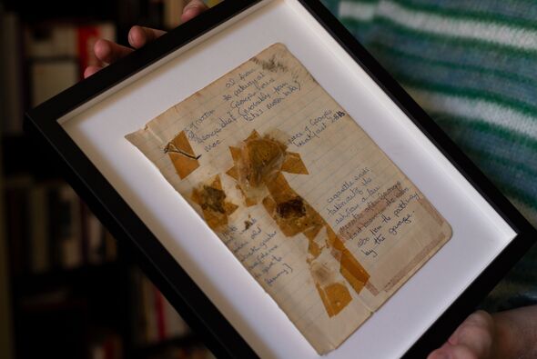 A page from a scrapbook with a piece of toast stuck to it in a picture frame
