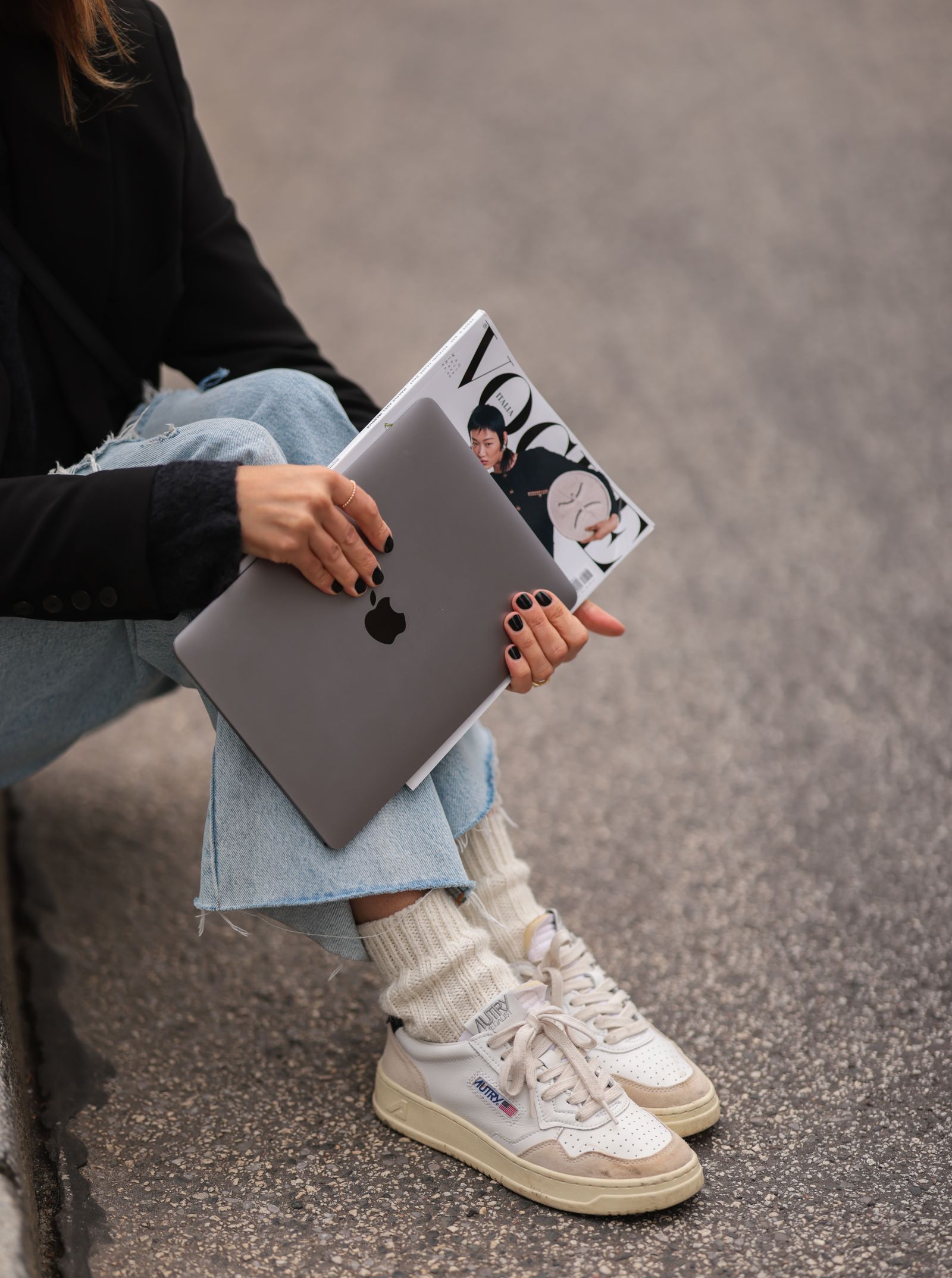 Image may contain Clothing Footwear Shoe Adult Person Sitting Sneaker Pants Accessories Jewelry and Ring