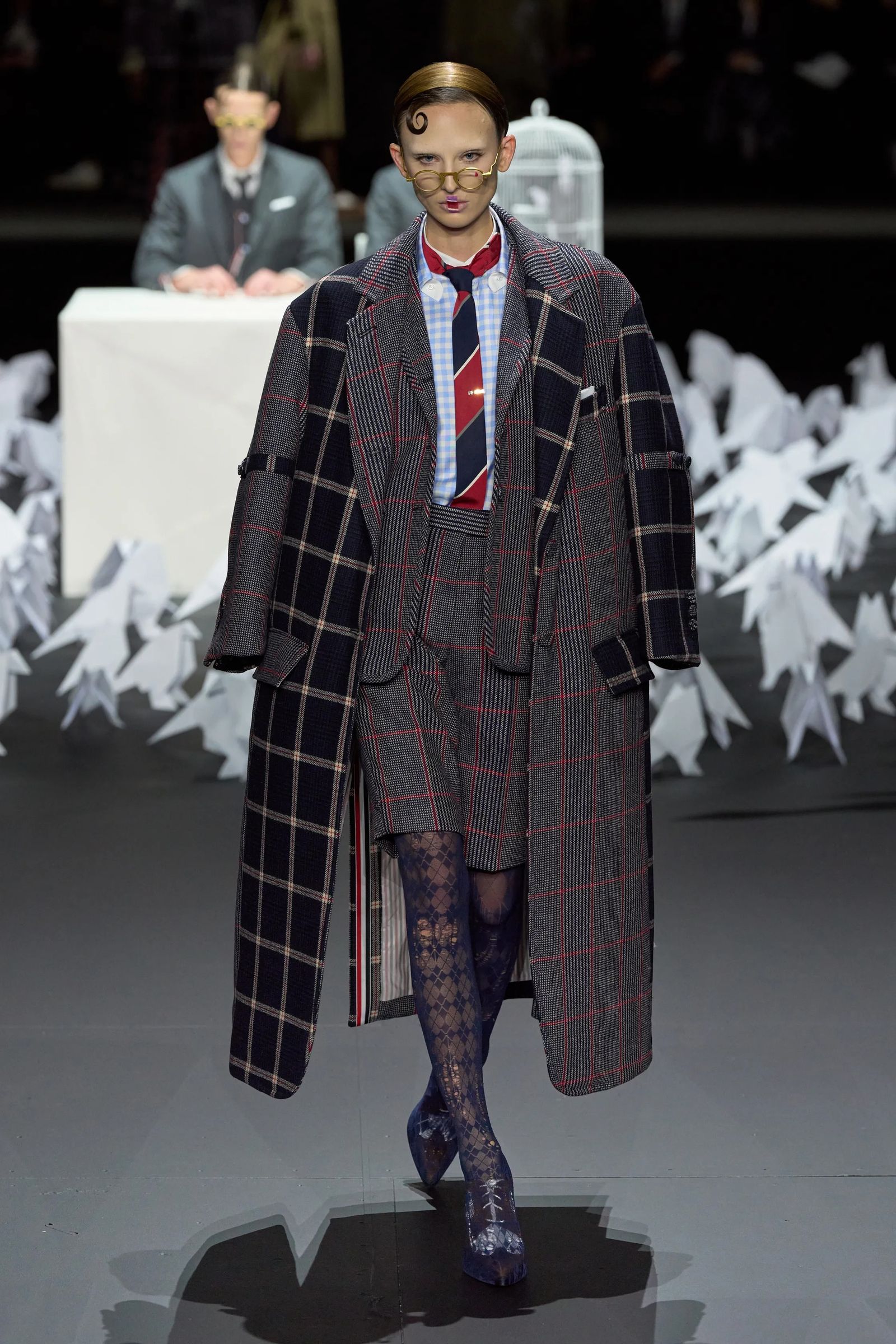 Image may contain Clothing Coat Person Fashion Accessories Formal Wear Tie Adult Overcoat and Glasses