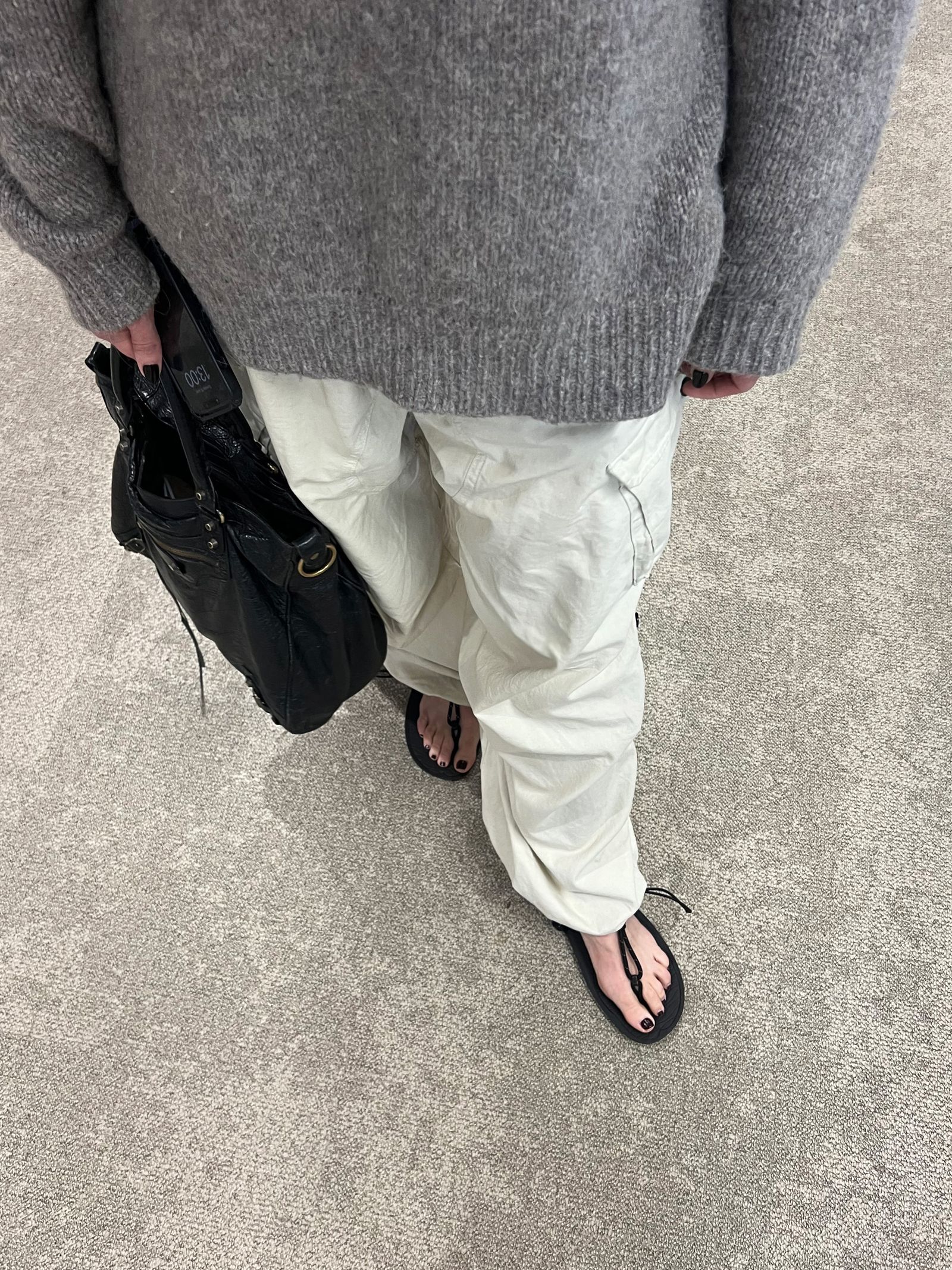 Image may contain Clothing Pants Footwear Sandal Adult Person Accessories Bag and Handbag