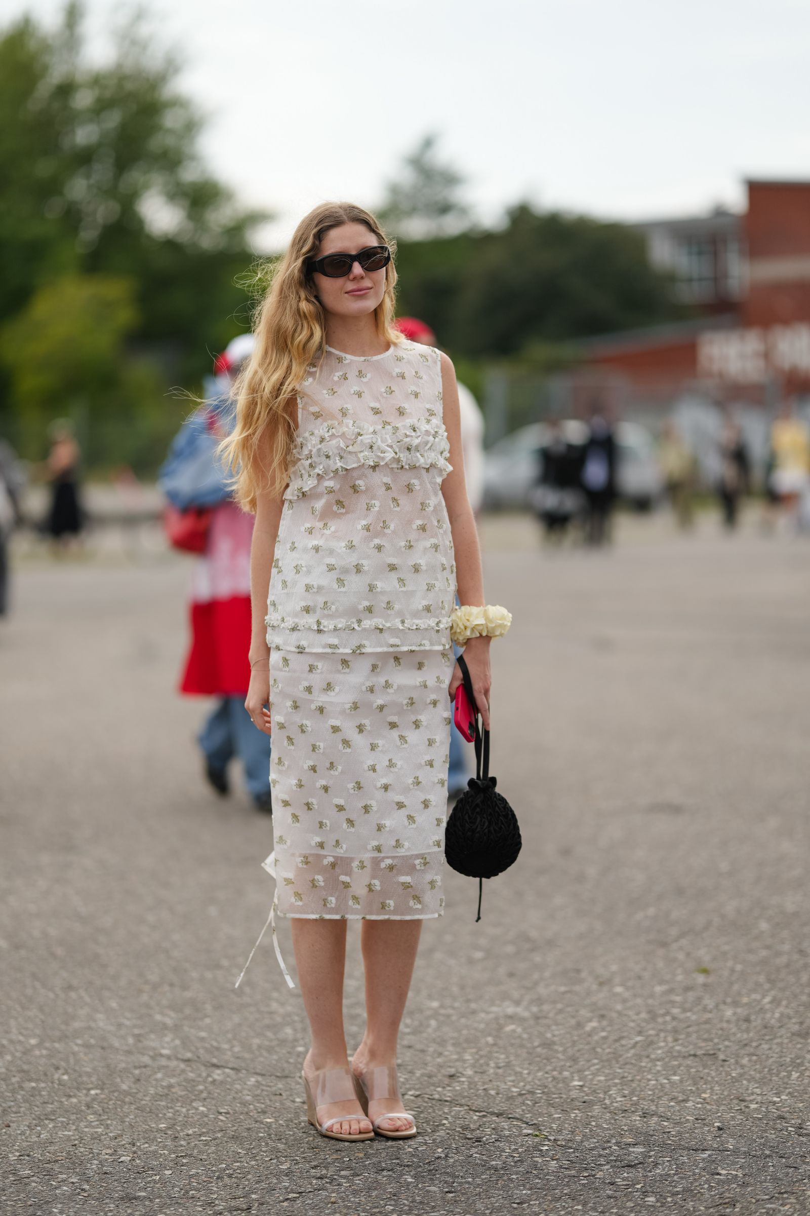Image may contain Adult Person Child Accessories Bracelet Jewelry Car Transportation Vehicle Clothing and Dress