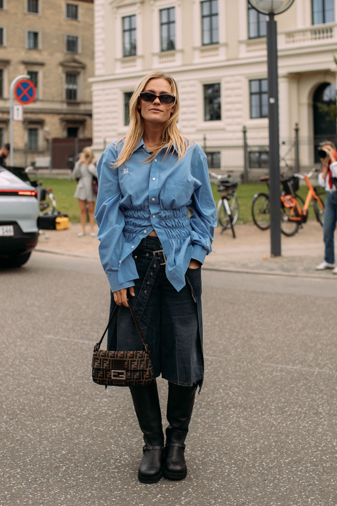 Image may contain Clothing Pants Jeans Accessories Bag Handbag Footwear Shoe Adult Person and Bicycle