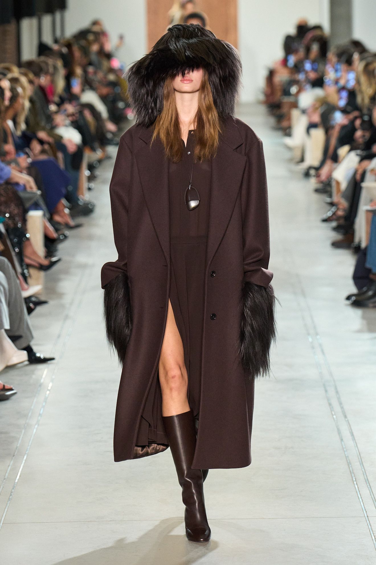Image may contain Christelle Lefranc Clothing Coat Fashion Adult Person Footwear Shoe and Overcoat