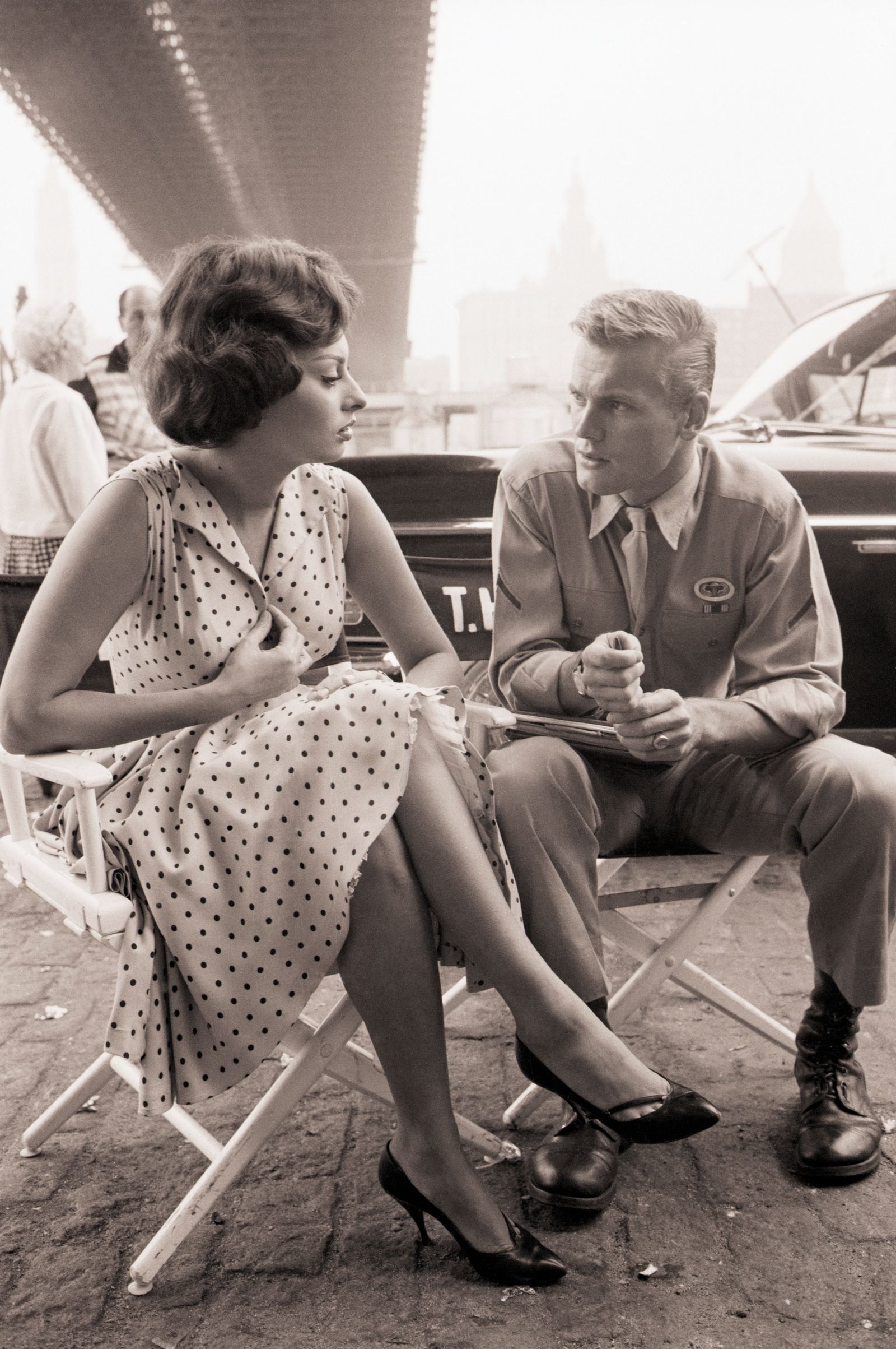 Image may contain Tab Hunter Sophia Loren Person Sitting Clothing Footwear Shoe Face Head Photography and Portrait