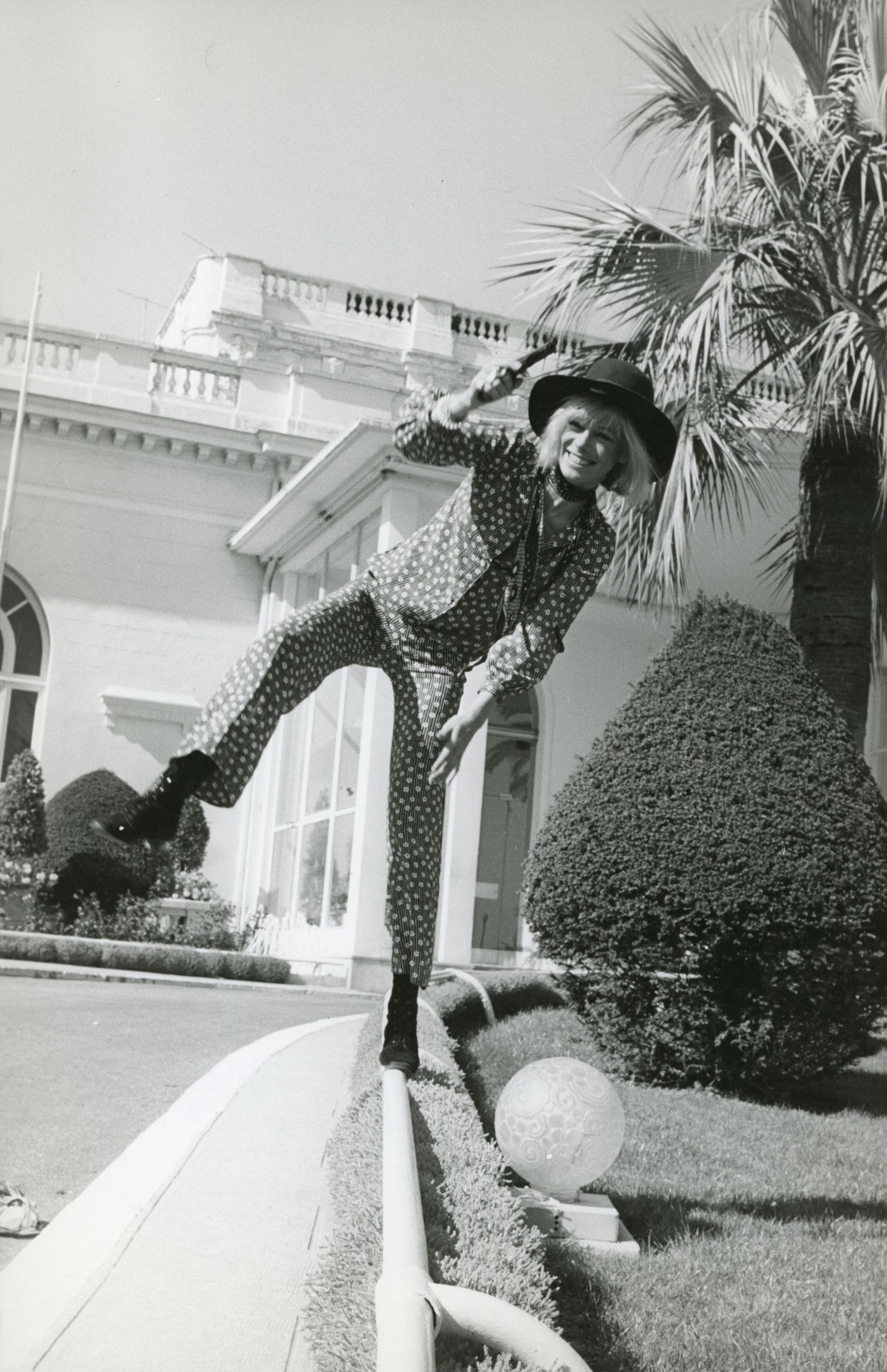 Image may contain Anita Pallenberg Plant Potted Plant Face Head Person Photography Portrait Palm Tree and Tree