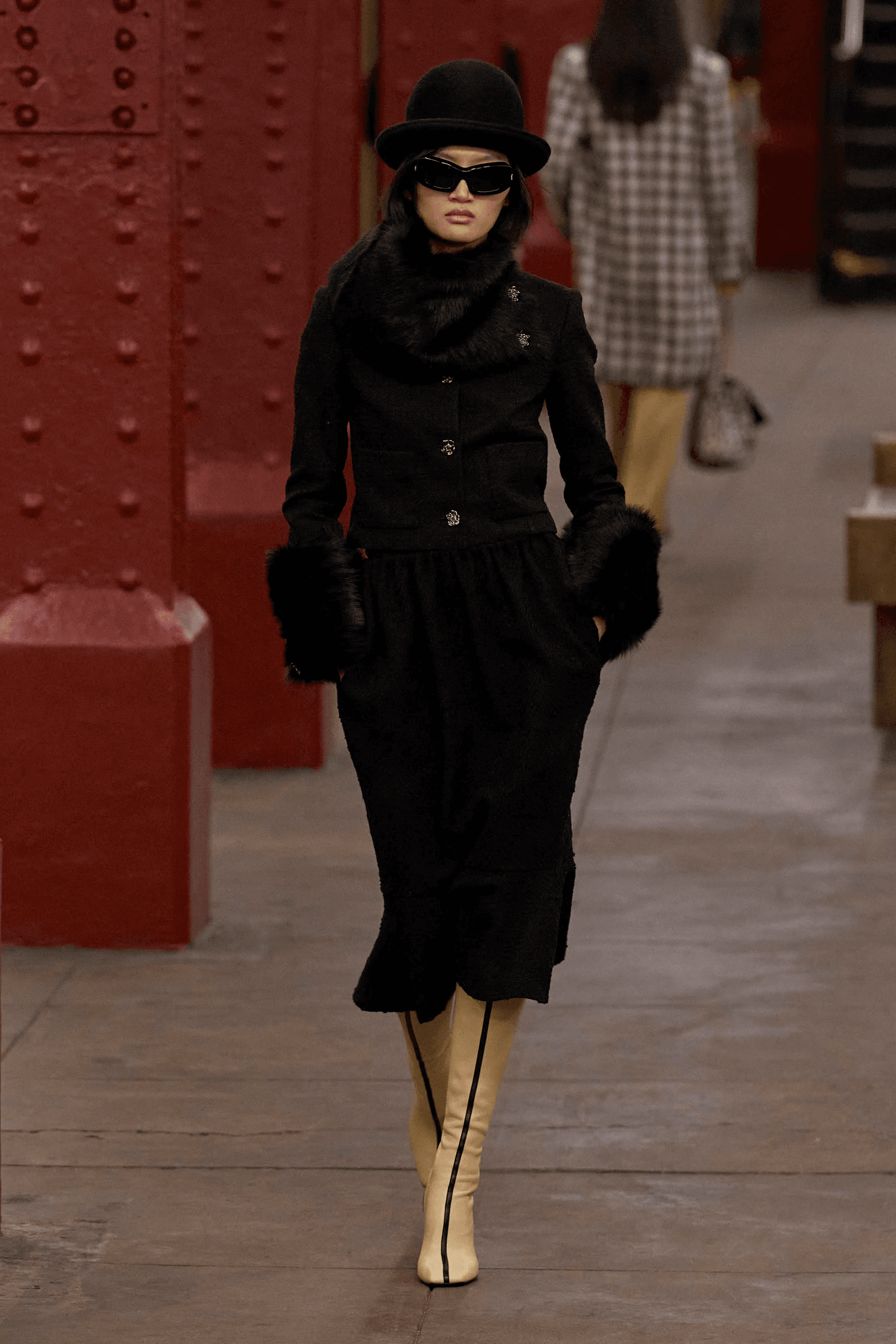 botas altas en Chanel prefall 2026.