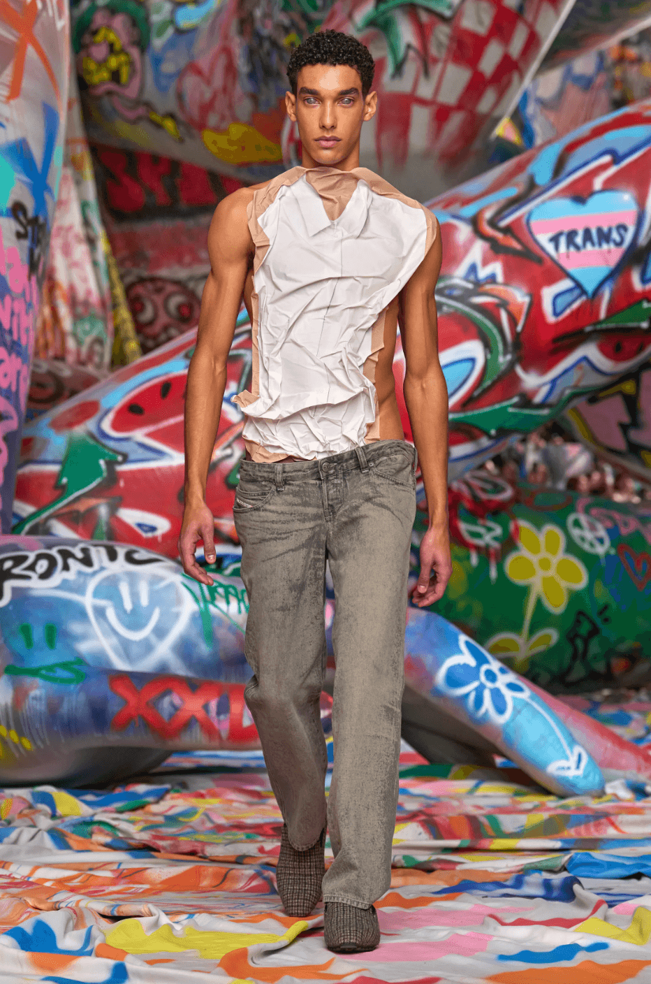 Image may contain Fashion Clothing Pants Adult Person Jeans Face and Head