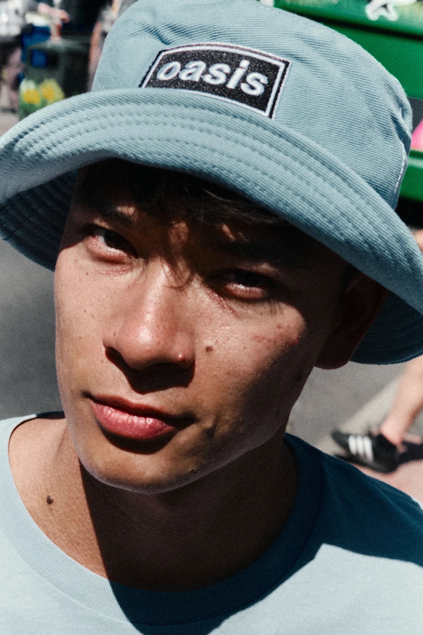 Image may contain Cap Clothing Hat Adult Person Face Head Baseball Cap and Skin