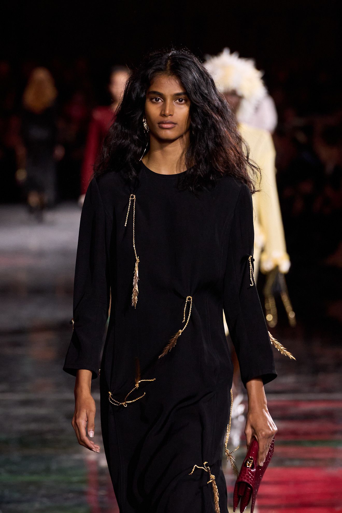 Image may contain Black Hair Hair Person Fashion Adult Face and Head