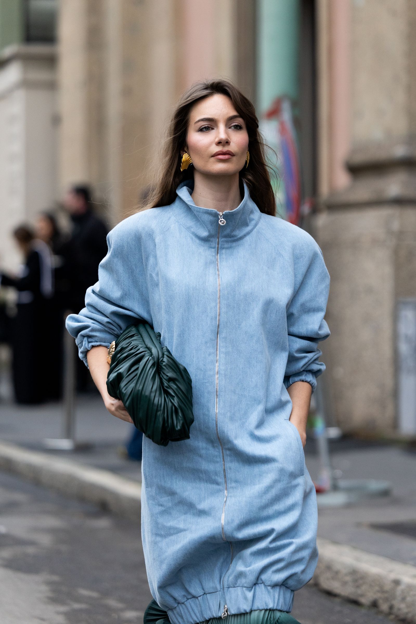 MILAN ITALY  JANUARY 18 Mara Lafontan wears a light blue zipfront denim dress with a high stand collar and elasticated...