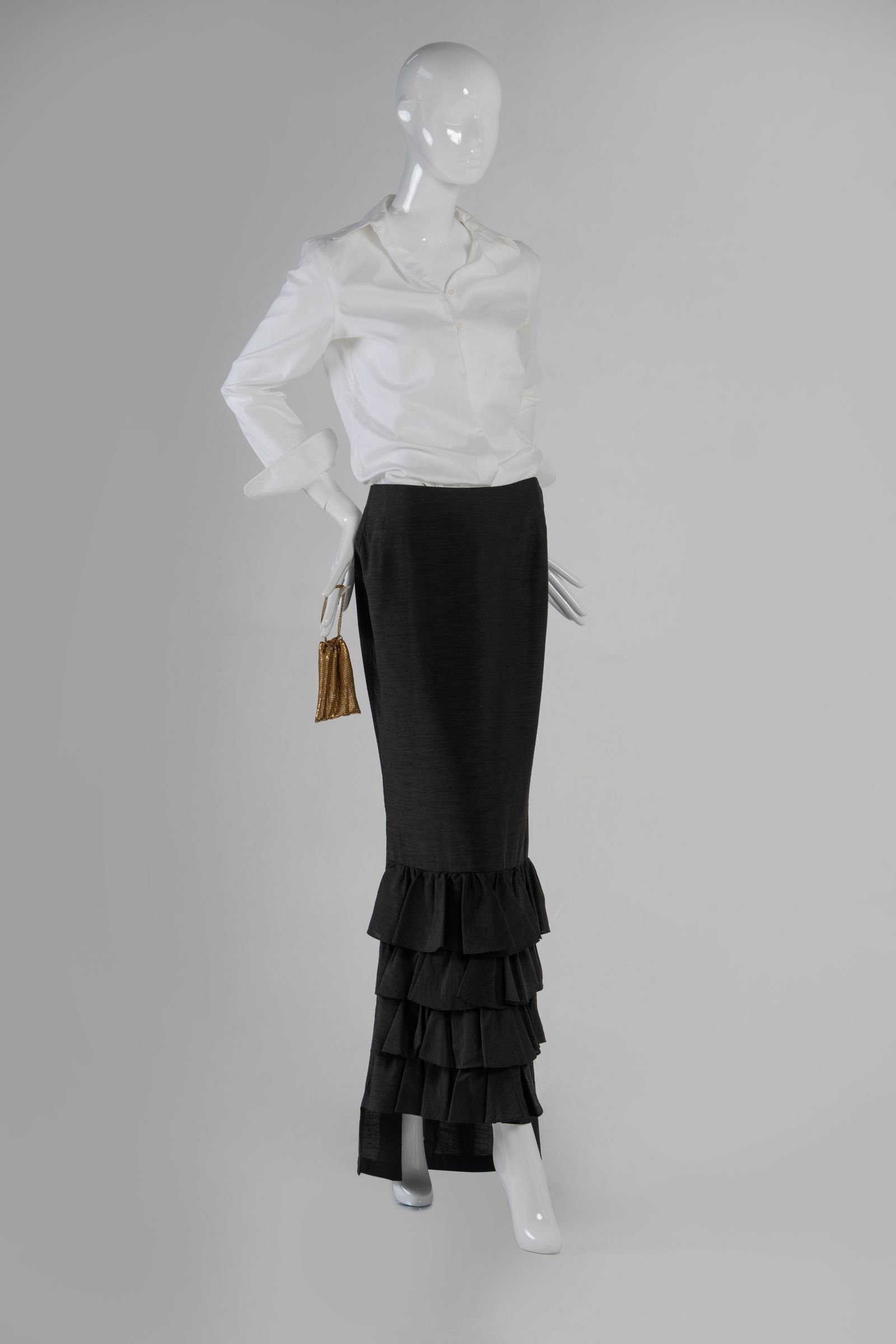 Image may contain Blouse Clothing Skirt Adult and Person