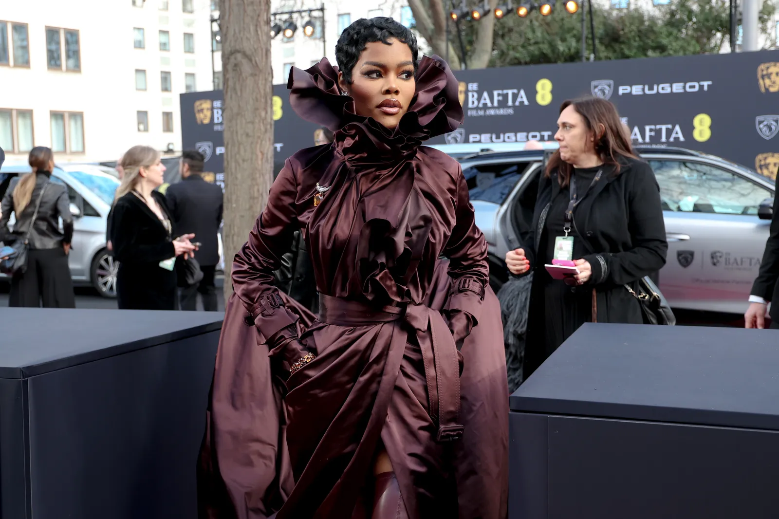 Image may contain Teyana Taylor Clothing Coat Adult Person Student Fashion Head Face Black Hair and Hair