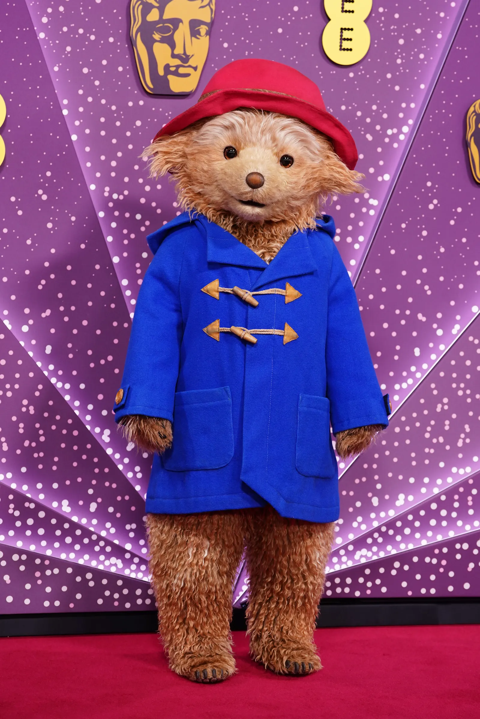 Image may contain Toy Doll Face Head Person Clothing Hat and Coat