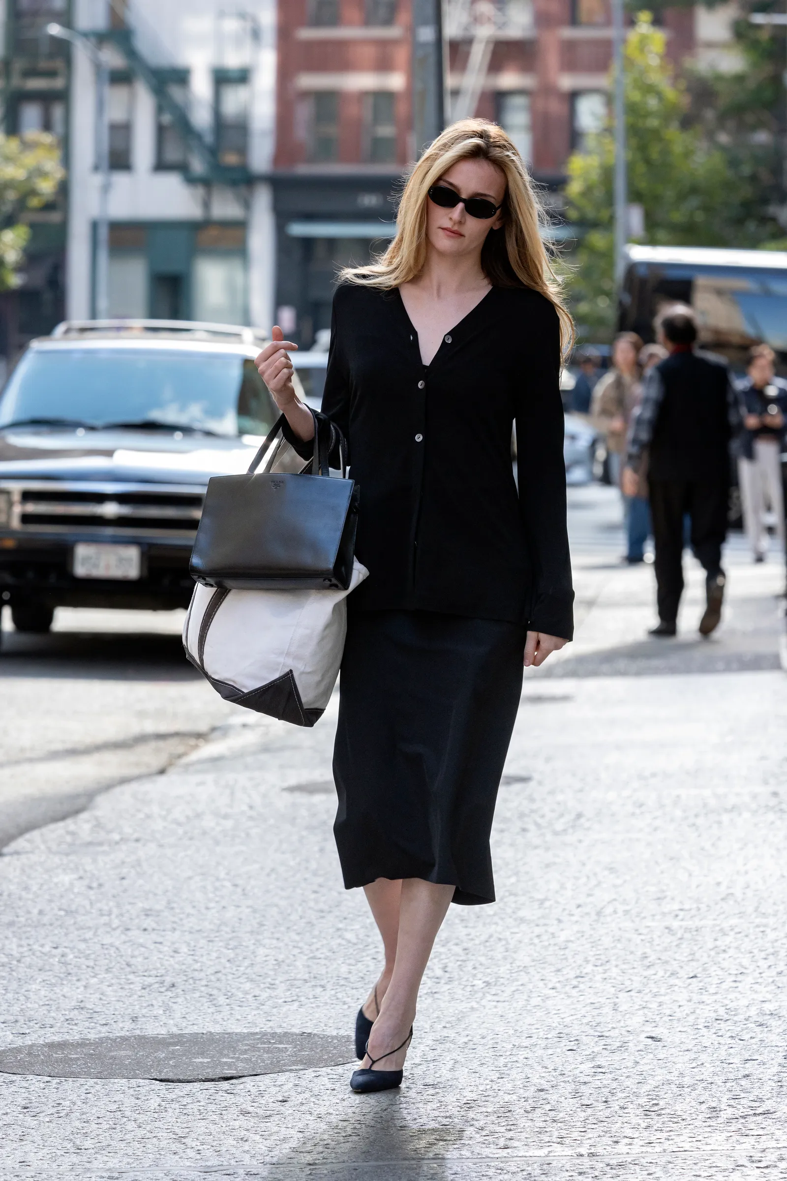 Image may contain Adult Person Pedestrian Accessories Bag Handbag Clothing Footwear Shoe Car and Transportation