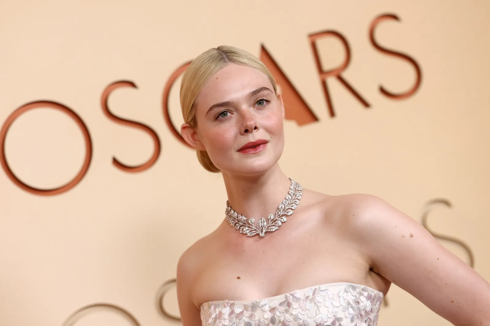 Image may contain Elle Fanning Blonde Hair Person Accessories Diamond Gemstone and Jewelry