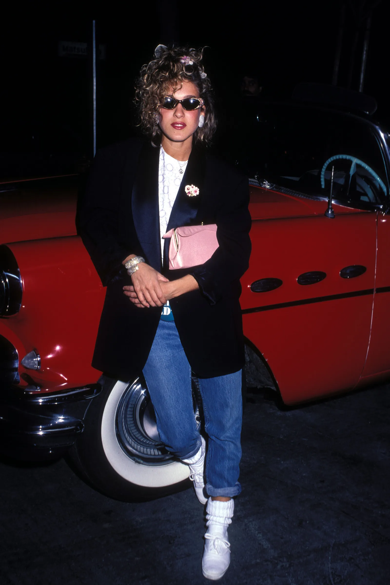 Image may contain Sarah Jessica Parker Clothing Coat Pants Blazer Jacket Adult Person Accessories and Glasses