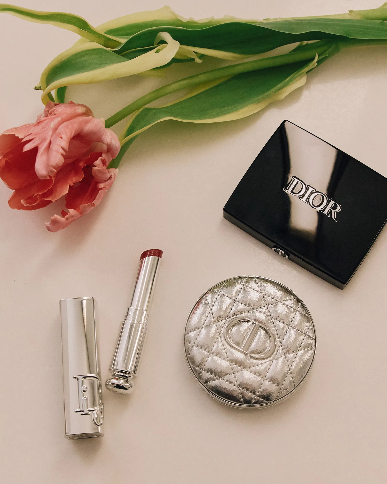 Image may contain Cosmetics Lipstick Flower Plant and Rose