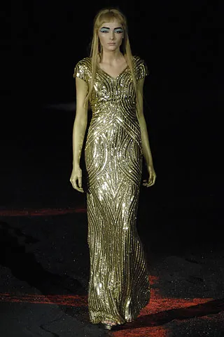 Image may contain Clothing Apparel Gown Robe Fashion Evening Dress Human Person and Dress