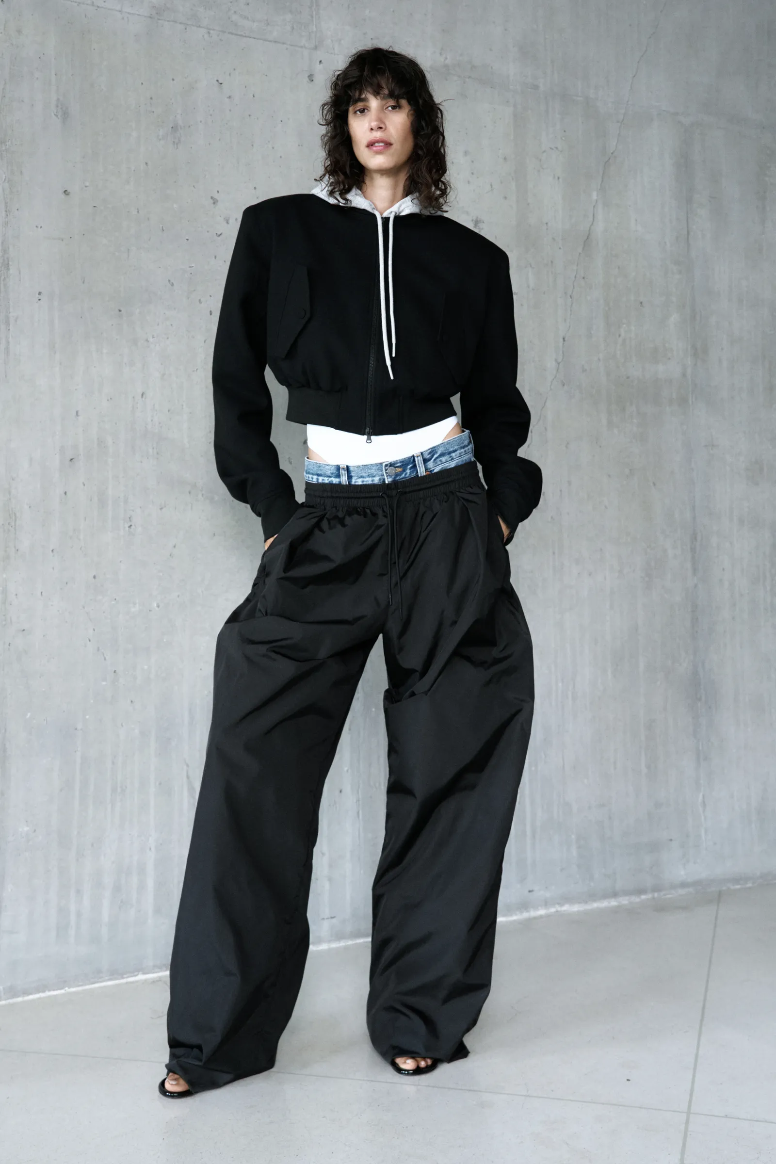 Image may contain Clothing Pants Formal Wear Suit Long Sleeve Sleeve Coat Adult and Person